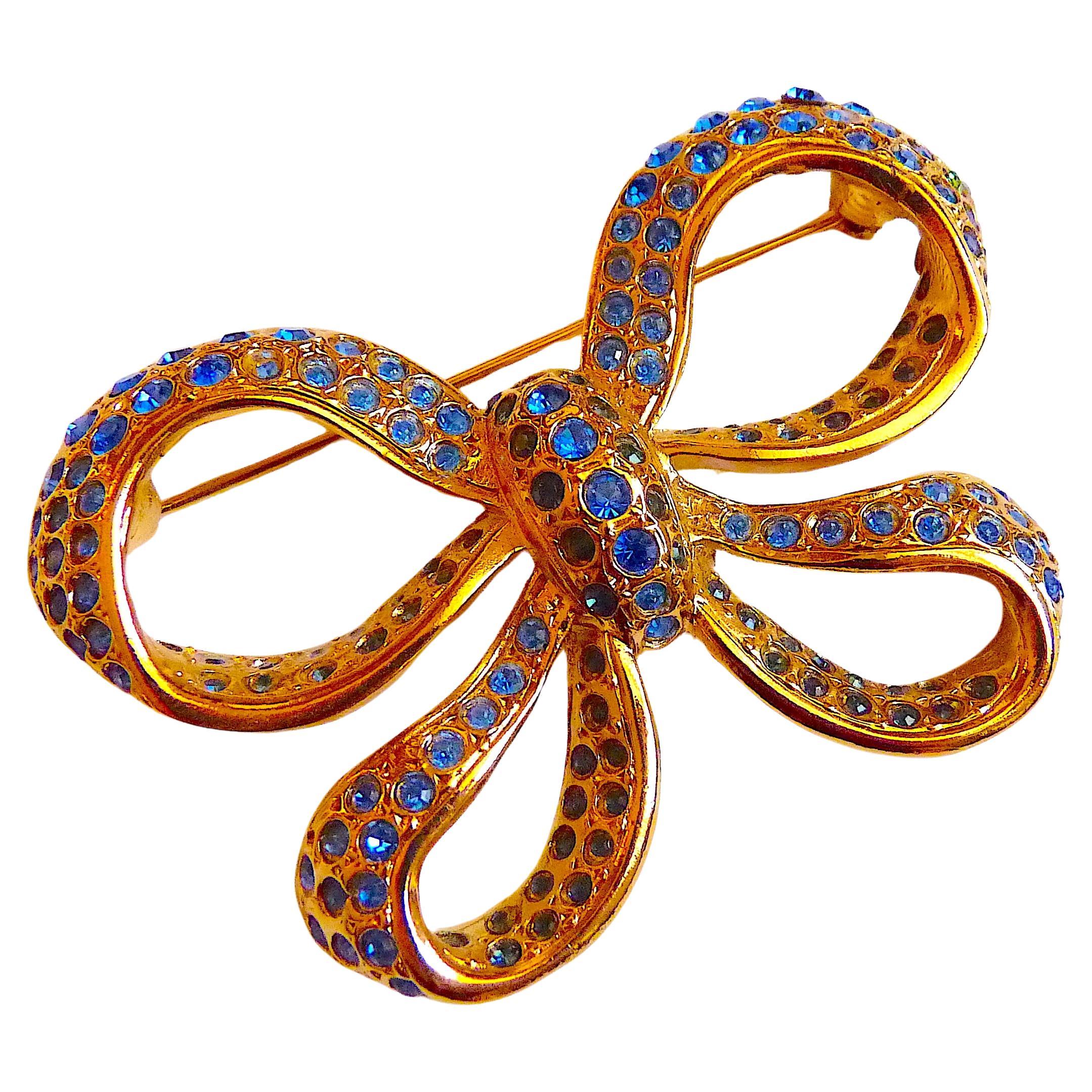 YSL Gilt Metal and Blue Crystal Stones Bow Brooch, Vintage 1980s For Sale