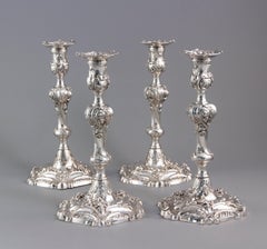 YSL Interest: a Set of 4 Cast George II Silver Rococo Candlesticks, London 1757