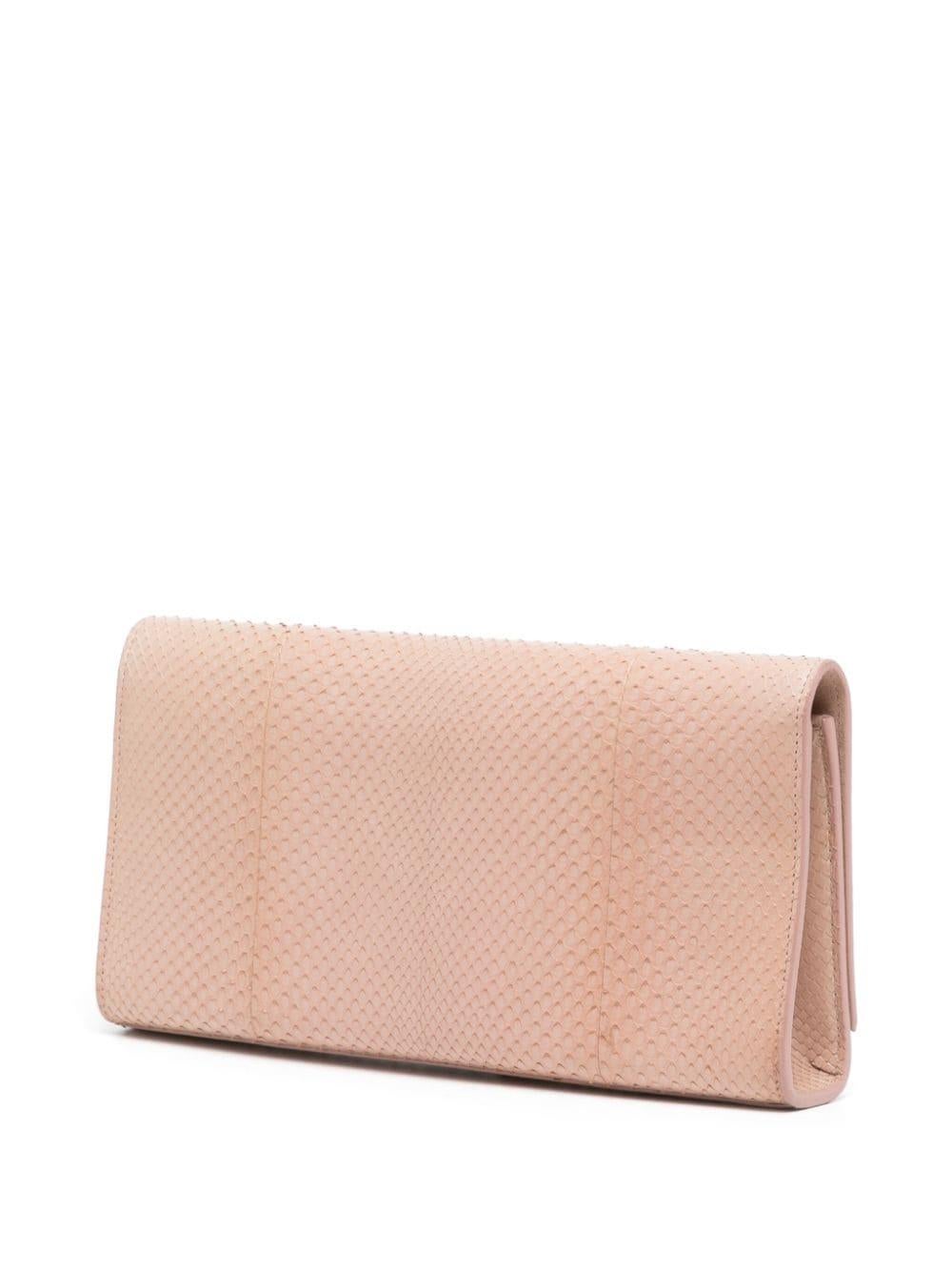 * Blush pink
* Exotic leather
* Signature YSL logo plaque
* Large tassel detail
* Fold over top
* Concealed magnetic fastening
* Main compartment, internal card slot & internal logo patch
* Very Good Condition: This pre-loved piece shows minimal