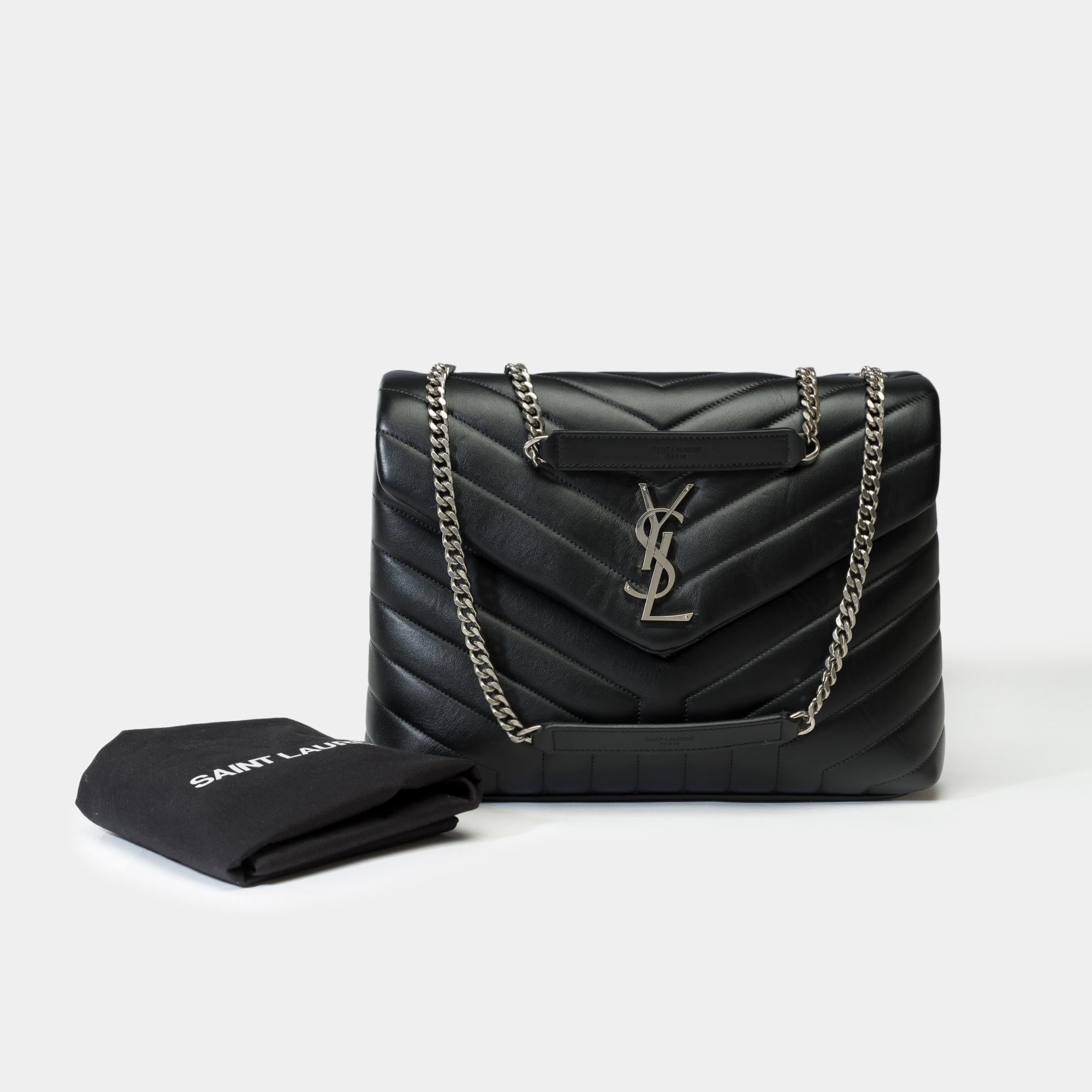 Elegant​ ​medium​ ​model​ ​Saint​ ​Laurent​ ​Loulou​ ​shoulder​ ​bag​ ​in​ ​black​ ​chevron​ ​quilted​ ​leather,​ ​hardware​ ​in​ ​gilt​ ​metal,​ ​one​ ​convertible​ ​chain​ ​strap​ ​in​ ​gilt​ ​metal​ ​allowing​ ​the​ ​bag​ ​to​ ​be​ ​worn​ ​in​