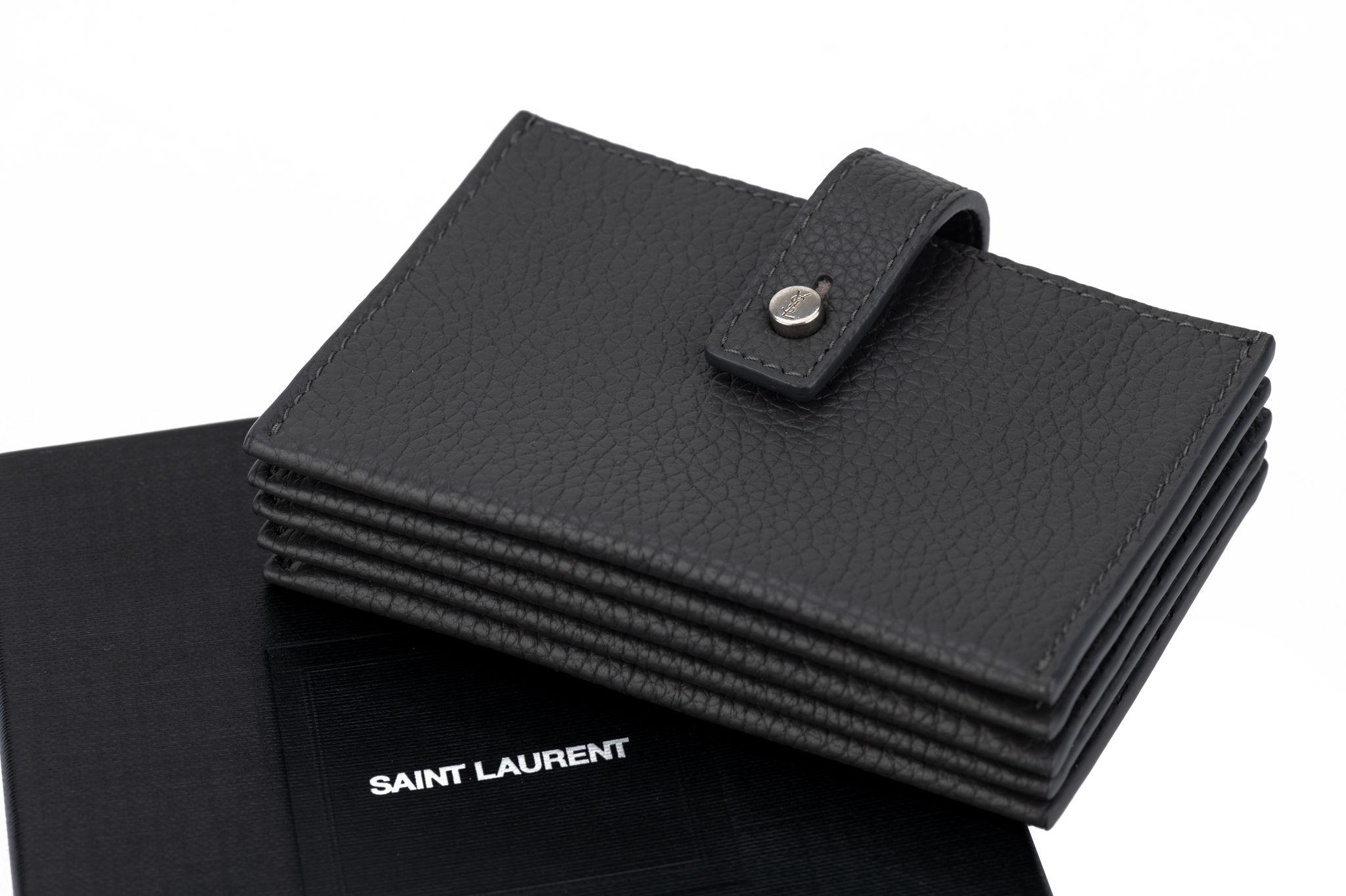 YSL brand new unisex credit card wallet, asphalt grey pebbled leather with logo silver details.
Comes with original dustcover and box.
