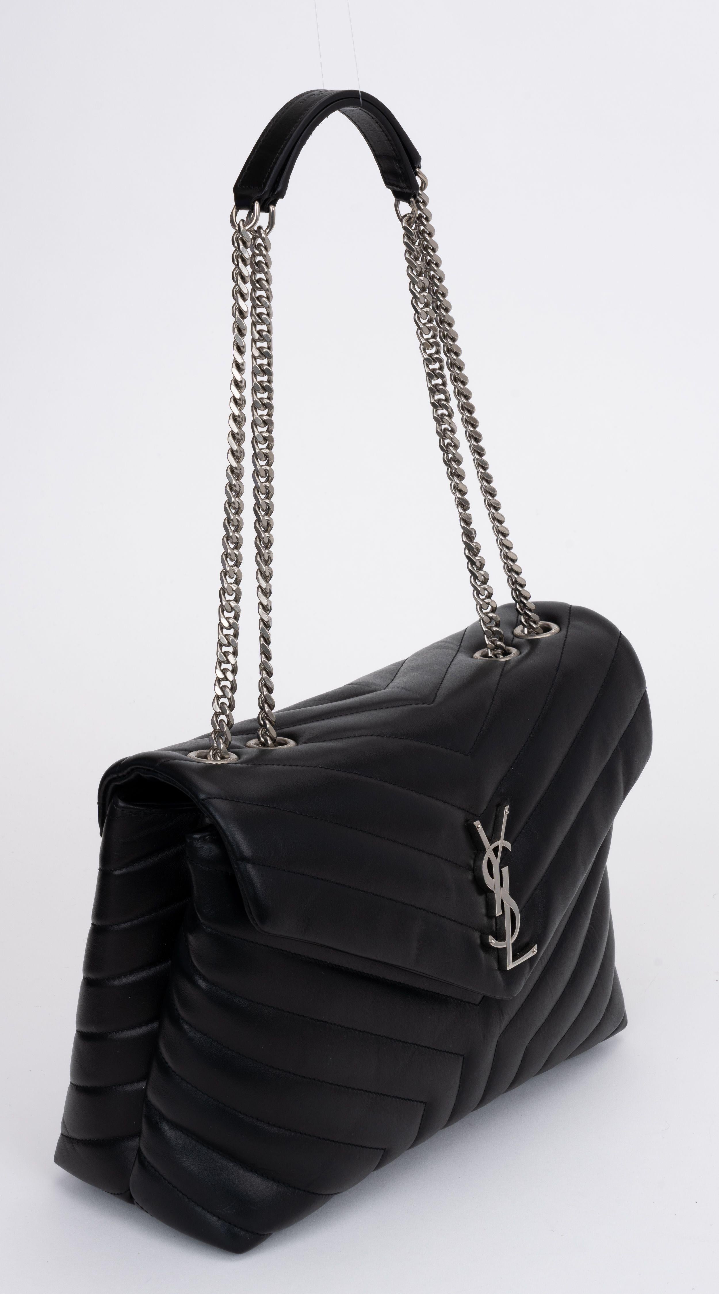YSL brand new medium loulou shoulder bag in black chevron quilted leather and ruthenium hardware. Two spacious compartments separated by an interior zipped pocket. Can be worn shoulder length or cross body. Shoulder drop 10