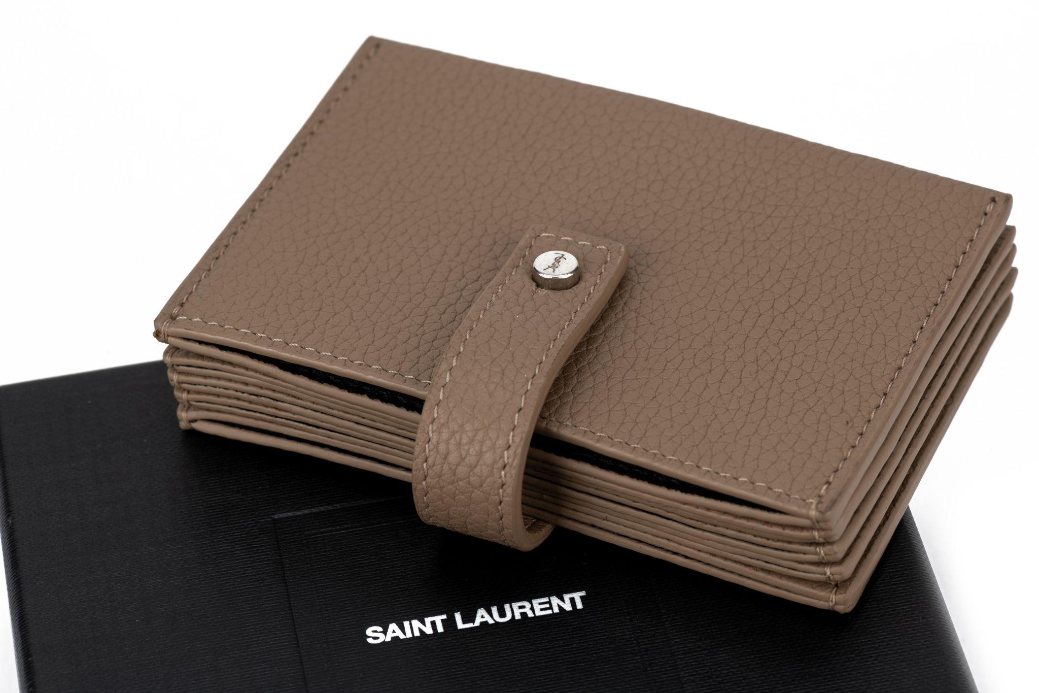 YSL brand new unisex credit card wallet, camel pebbled leather with logo silver details.
Comes with original dustcover and box.