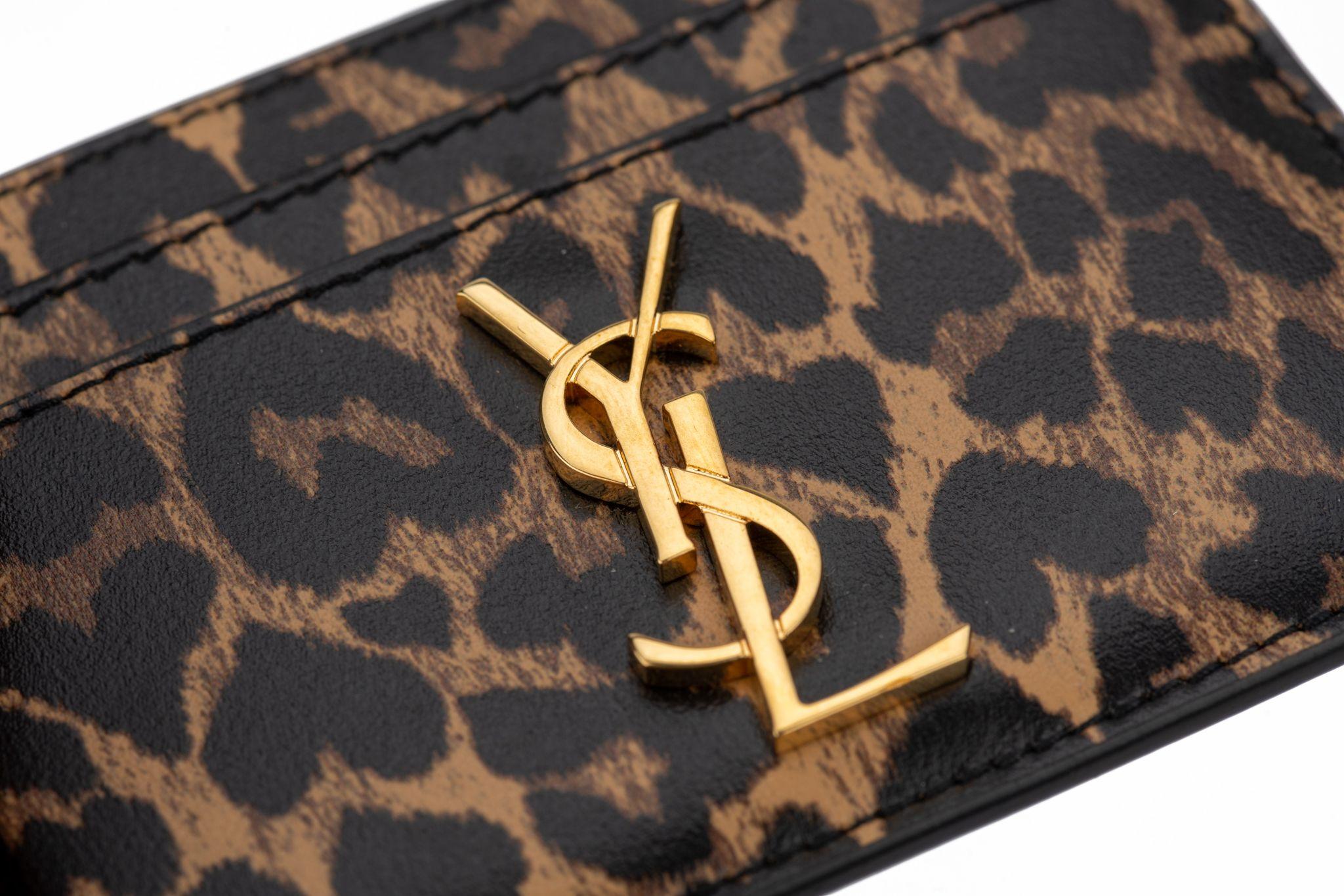 YSL new cheetah print credit card wallet with gold tone metal logo. 
Comes with original box.
