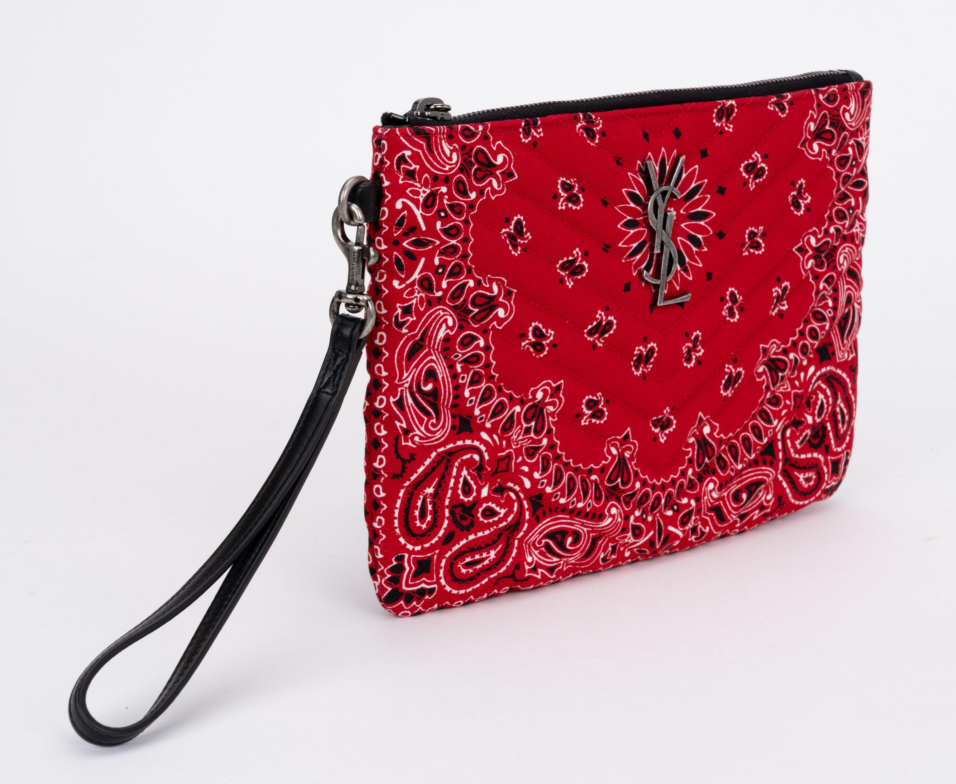 YSL brand new bandana pattern quilted in red, white and black. Black leather detachable wristlet handle, ruthenium hardware. Multiple credit card slots, comes with booklet and original dust cover.