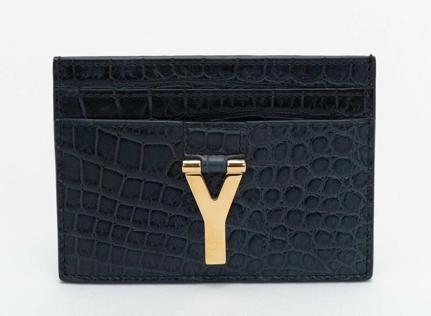 YSL New Card Case in petroleum crocodile - embossed shiny leather.
Gold metal logo on the front.
5 card slots.
Comes with booklet, tag, original dust cover and box.