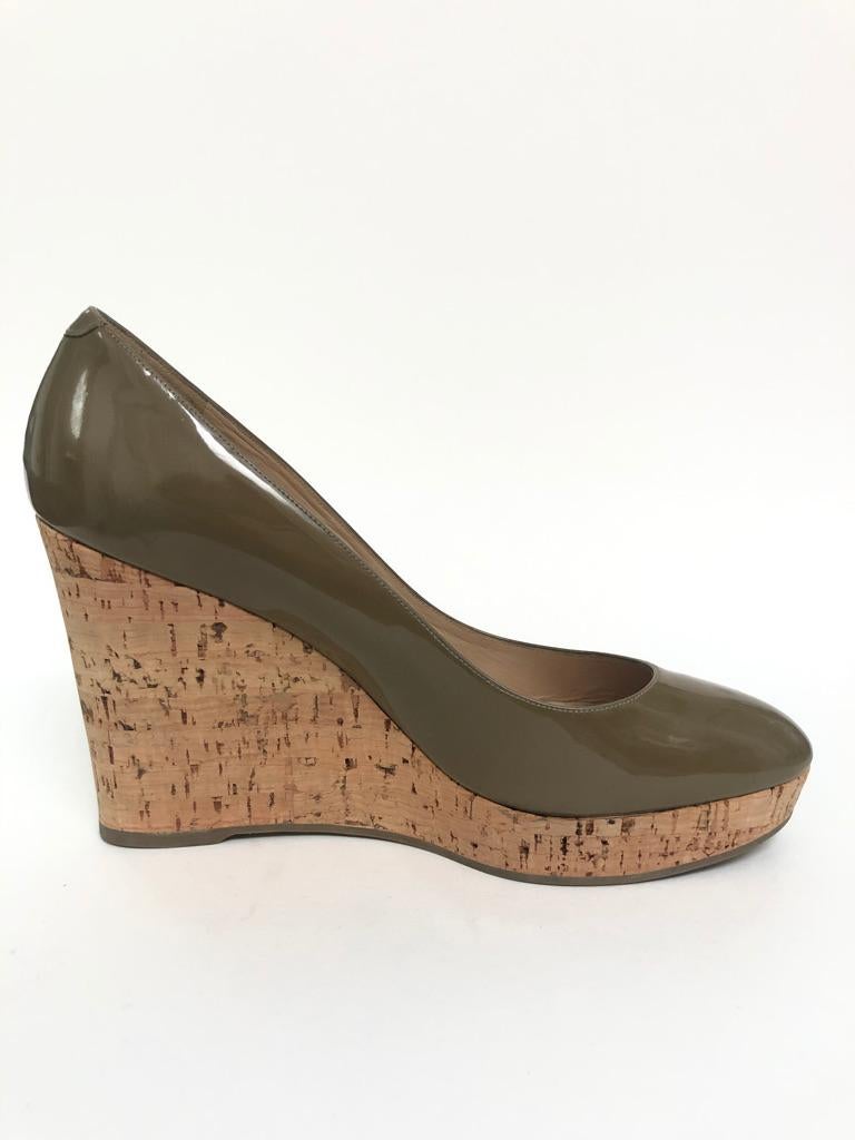 Great every day shoe, cork wedge, patent upper. Small scuff on toe (pictured)