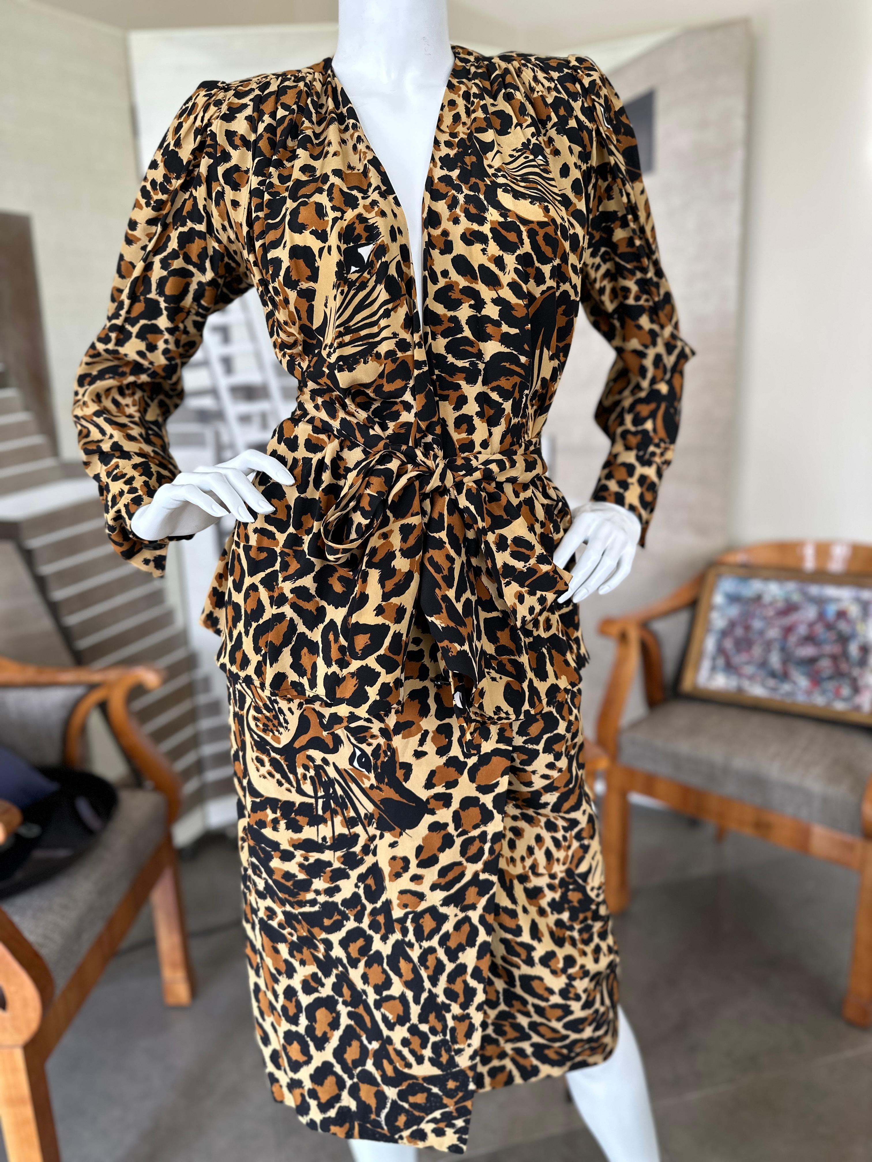 Yves Saint Laurent Rive Gauche Fall 1986 Silk Leopard Print 3 Pc Cocktail Dress.
Featuring a wrap skirt, long sleeve blouse and long wide sash belt.
  This is so pretty, it is much sexier than the photos show. 
  Size 36
  Bust 38