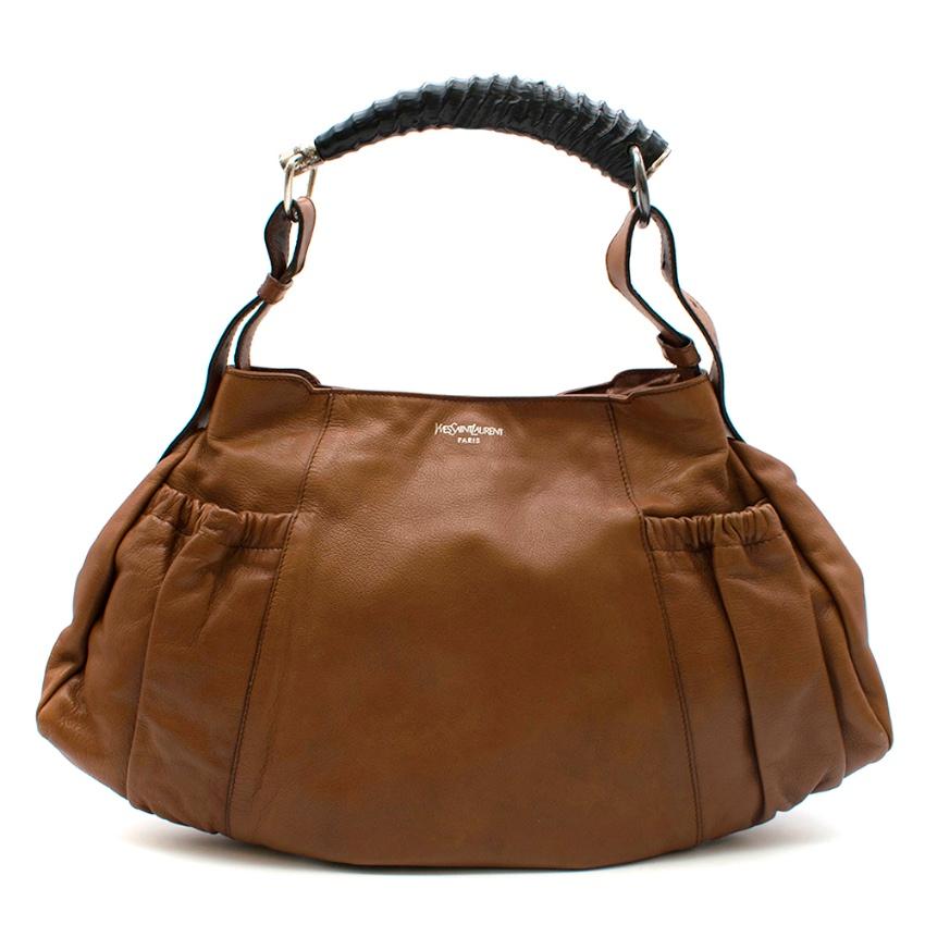 YSL Rive Gauche Vintage Brown Leather Handbag

- Vintage
- Hobo bag
- Two front/two back pouch pockets
- Front zip pocket
- Front pocket with buckles
- Inside zip pocket
- Inside small pouch pocket
- Adjustable handle
- Snap button closure
- Faux