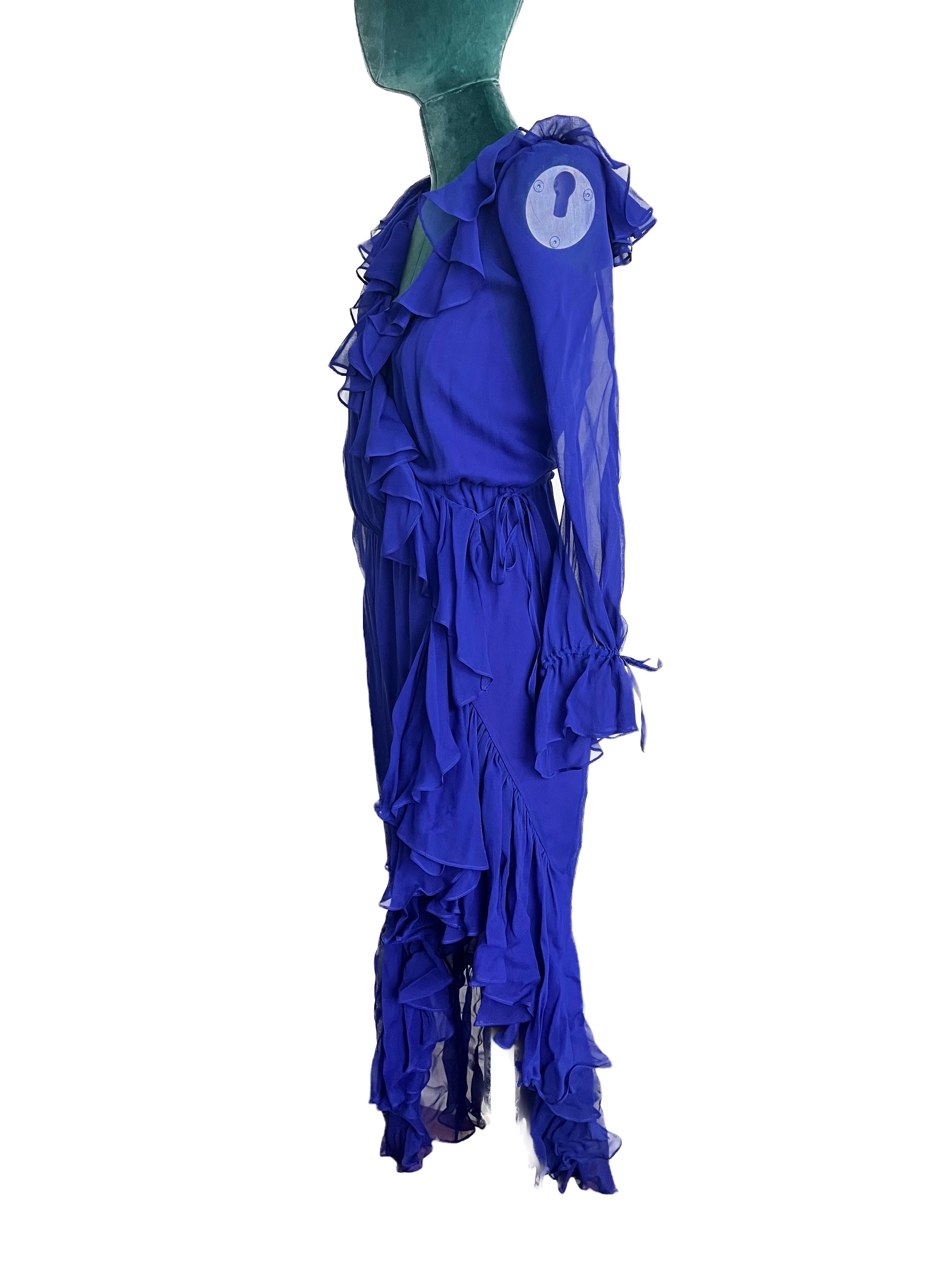 Saint Laurent Blue Chiffon Wrap Dress with Ruffle Detail

Elevate your style with the ethereal charm of the Saint Laurent Blue Chiffon Wrap Dress featuring exquisite frugal detailing. This captivating piece seamlessly blends timeless elegance with