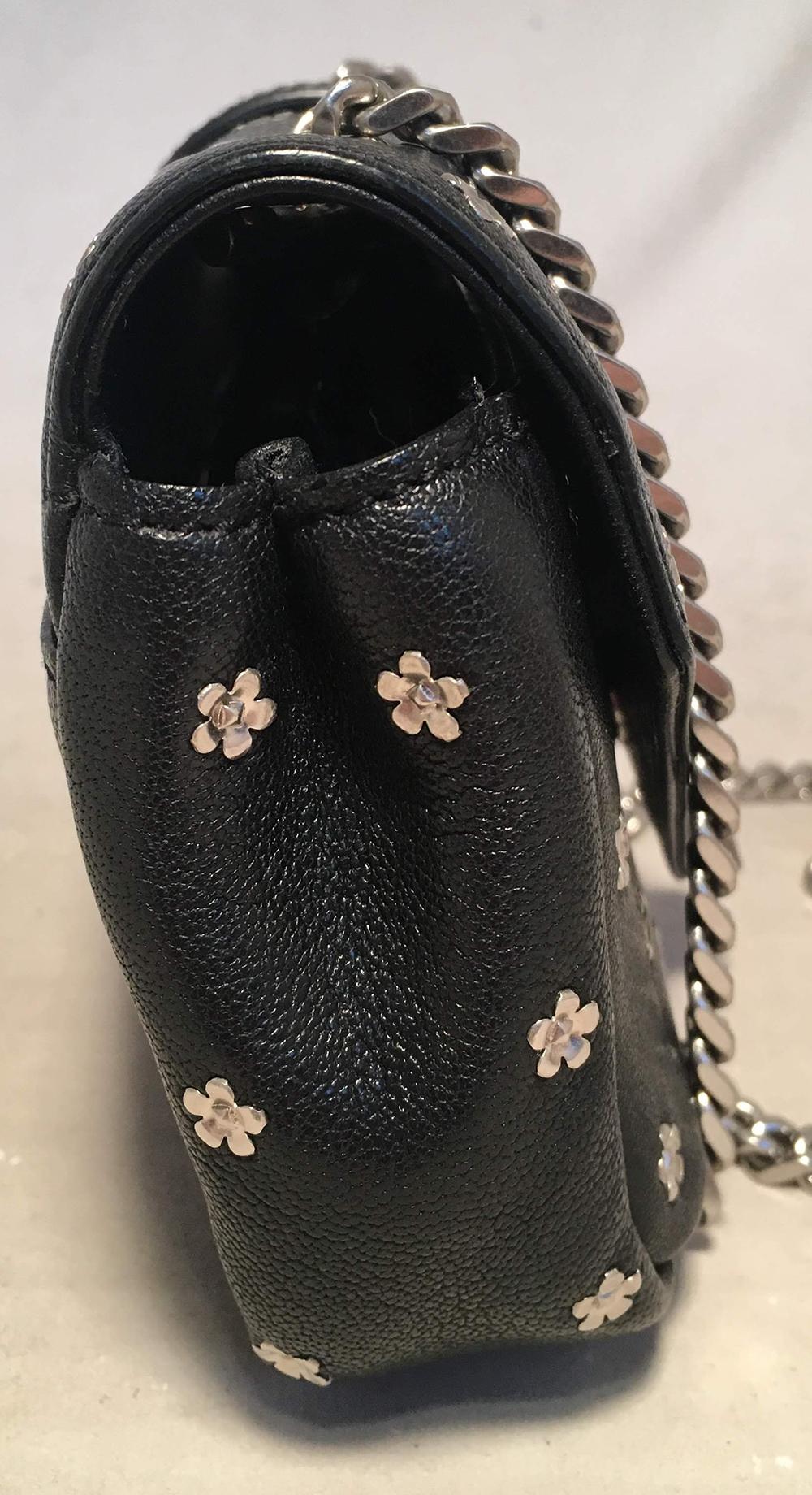 YSL Saint Laurent Black Leather Flower Studded Small Envelope Chain Shoulder Bag in excellent condition. Black leather exterior trimmed with small delicate silver flower studs throughout and signature YSL logo along front top flap. Silver chain