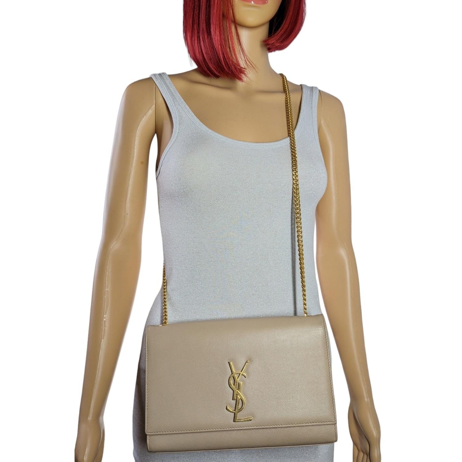 An iconic insignia nods to the Parisian fashion house's heritage on this chic shoulder bag designed in perfect proportions. Retail $2,400.

Designer: YSL Saint Laurent
Material: 100% Calfskin
Origin: Italy
Color(s): Dark Beige
Measurements: 9 ½
