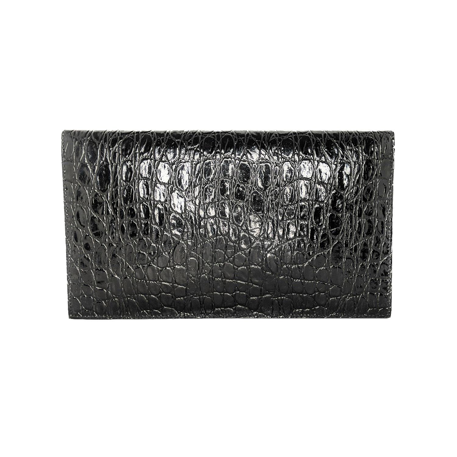 Saint Laurent's 'Uptown' pouch fits everything you need for an evening at a gallery opening or rooftop bar. It's been made in Italy from glossy croc-effect (Calf) leather and decorated with the iconic 'YSL' hardware in gold. Carry it in hand or slip