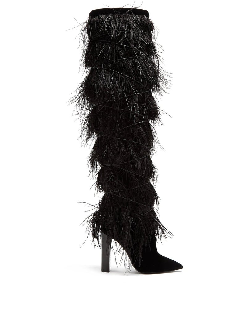 Knee-high boots were a key part of Saint Laurent's Runway collection, but none are as dramatic or playful as this black style. The product of fine Italian craftsmanship, they feature a tumbling selection of feathers that fall over the slouchy