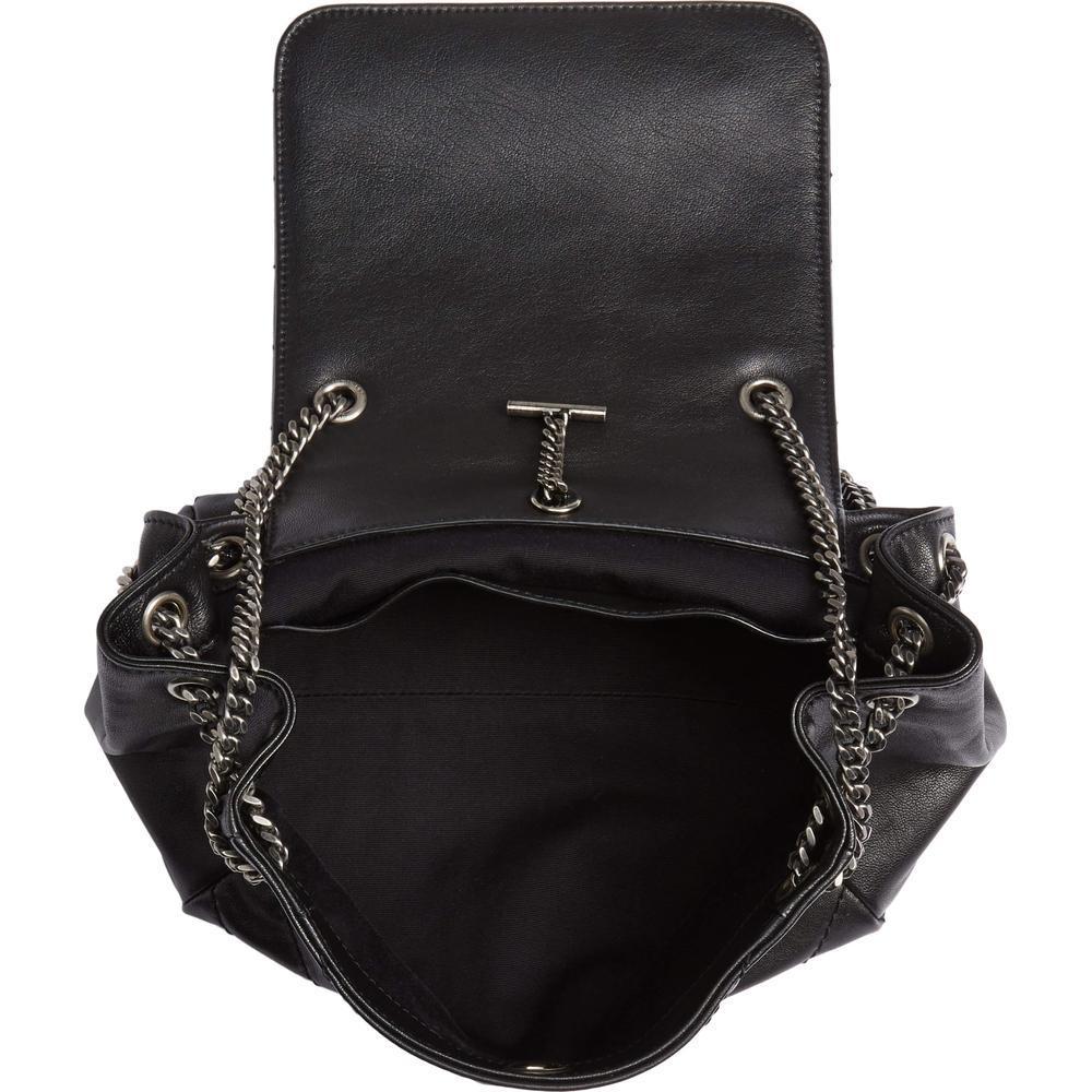 Satisfy your wanderlust in opulent style with this compact lambskin leather shoulder bag adorned with an assemblage of souvenir-style pins.

Parisian elegance with a new-age rock-and-roll edge. Iconic leather accessories are tweaked and re-worked to