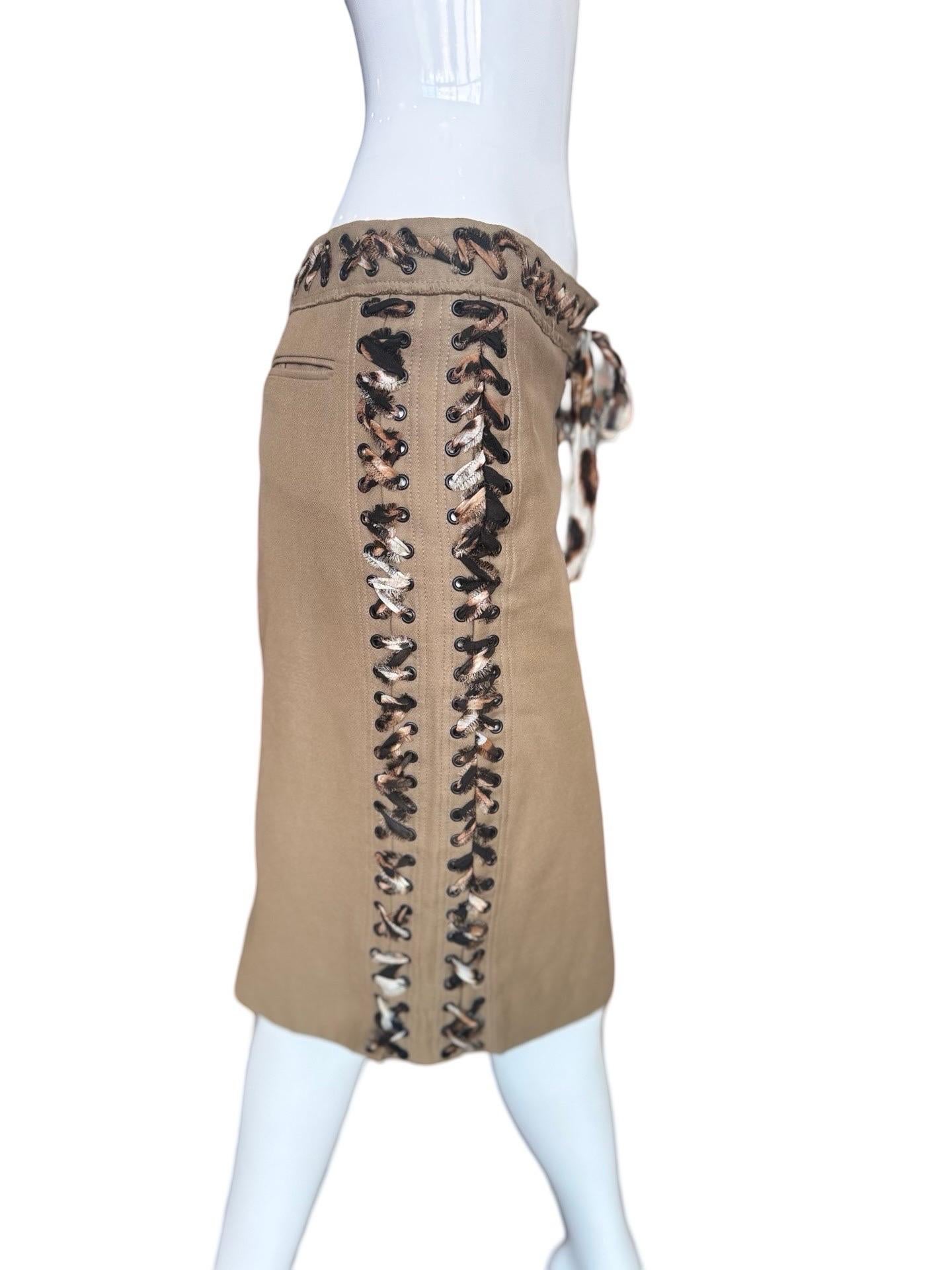This is classic and sexy piece from the YSL Tom Ford years. Heavy cotton pencil skirt with leopard print silk scarf tie up the side and belt in the front.  There is no zipper!  There is some extra divet at the front where the fabric ties that