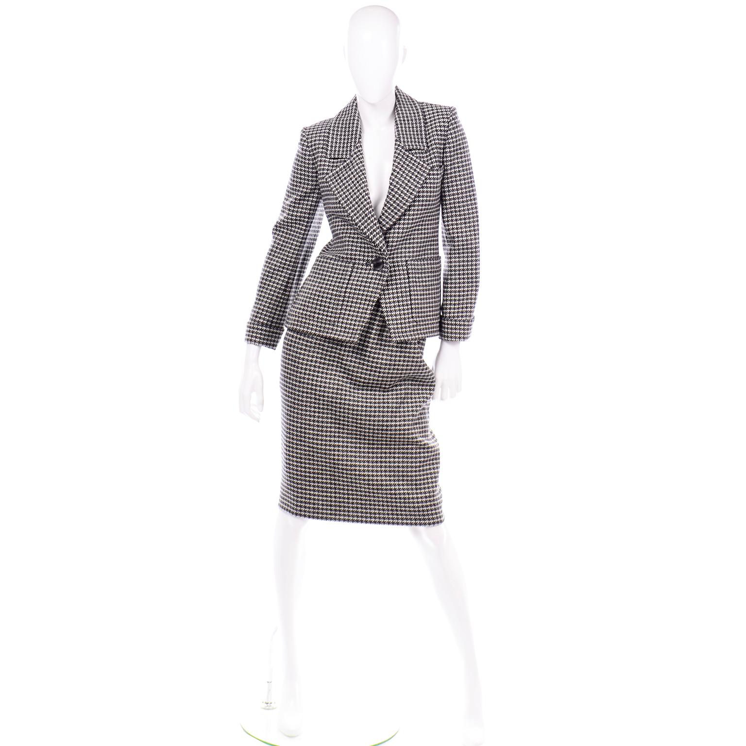 This vintage YSL two piece houndstooth wool skirt suit is in as new condition. This Yves Saint Laurent Rive Gauche early 1980's pencil skirt and single breasted blazer  jacket was most likely never worn! The suit is fully lined and has beautiful