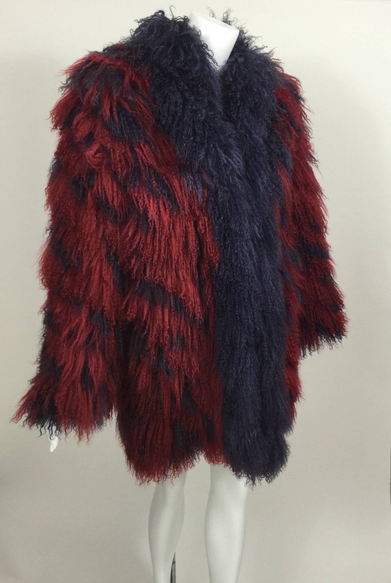 A shaggy Mongolian lamb fur coat in red and purple stripe. 
Fully lined.

Measurements:
Bust and Waist:  up to 40 inches
Length: 31 inches
Sleeve length: 24 inches
Shoulders: 18 inches
