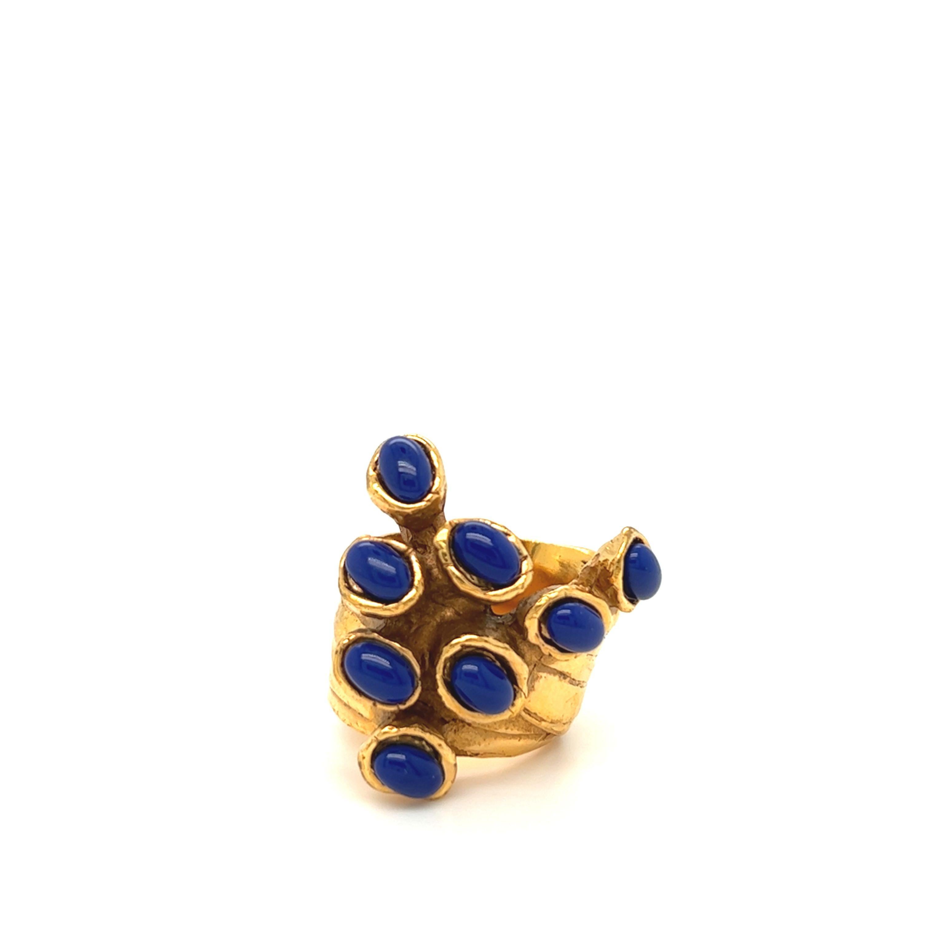 Yves Saint Laurent YSL “Arty Dots” ring by Stefano Pilati in antique gold tone metal set with blue cabochons.

Size: 6 
Made in: Italy
Gross Weight: 21.9 grams
Signed. 
Period: 2000s
Band Width 15mm,
Ornament Width 29mm,
Ornament Length 29 mm.