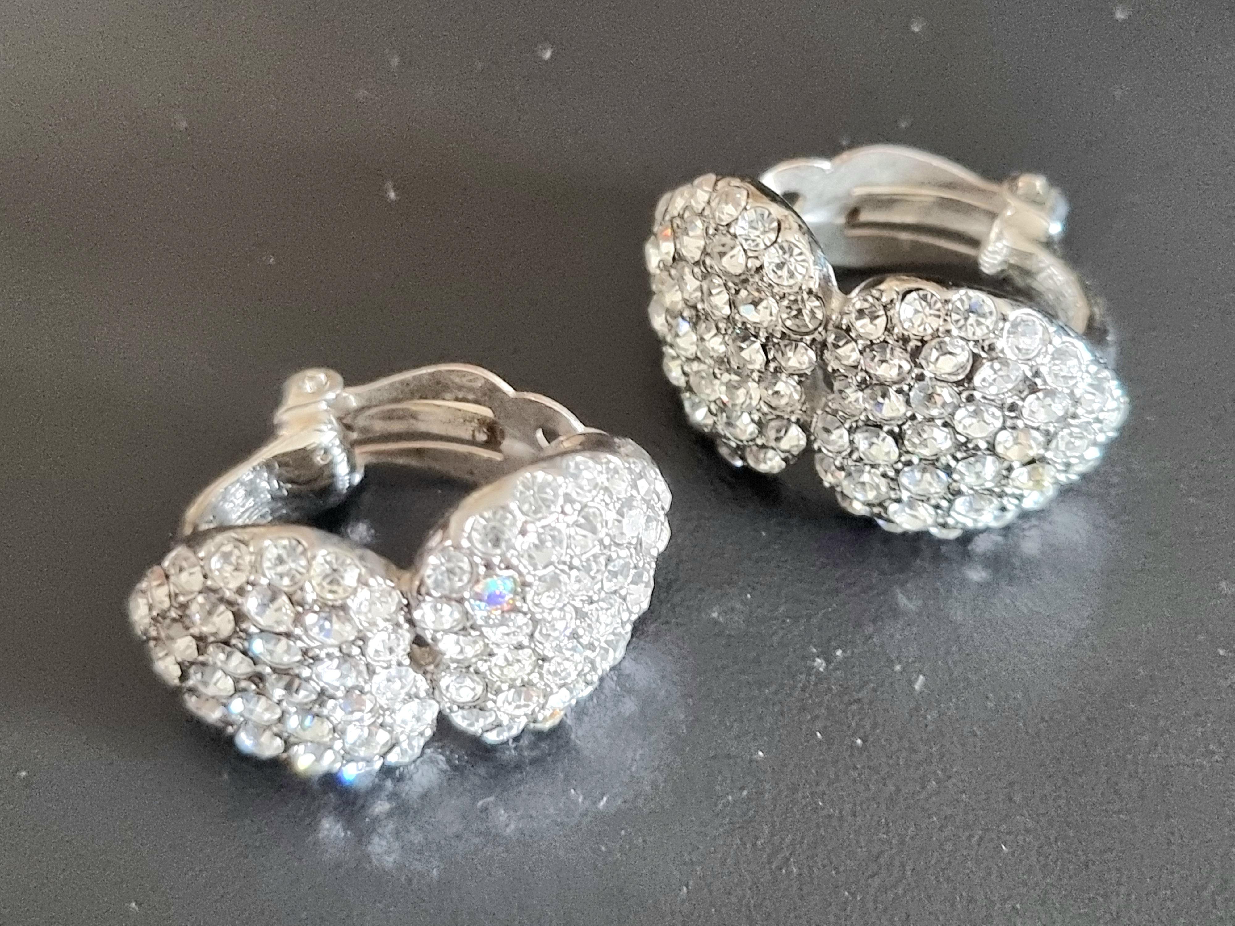 Magnificent Clip-on Earrings,
80s vintage,
in silver metal adorned with glass rhinestones,
by YVES SAINT LAURENT, haute couture, 
signed YSL (clasp and on the back), inscription 