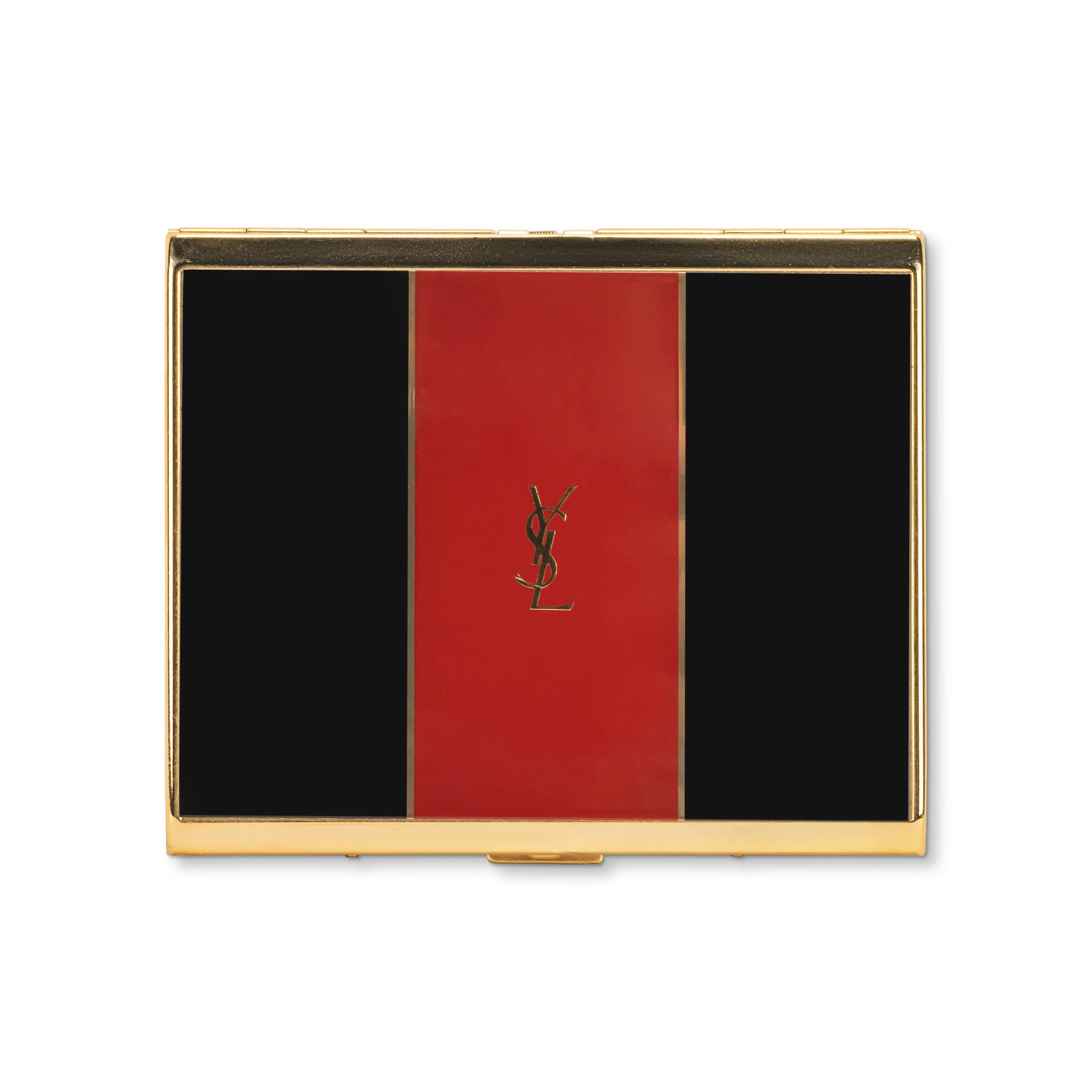 “YSL” Yves Saint Laurent retro cigarette case 
This is the large Case, Pelaee see images and video. 
Logo Cigarette Case Gold Black Red
The case is in great condition.
The clasp snaps as new. 
Retro. 
1970s
Gold plated. 
Signed YSL.
Very elegant and