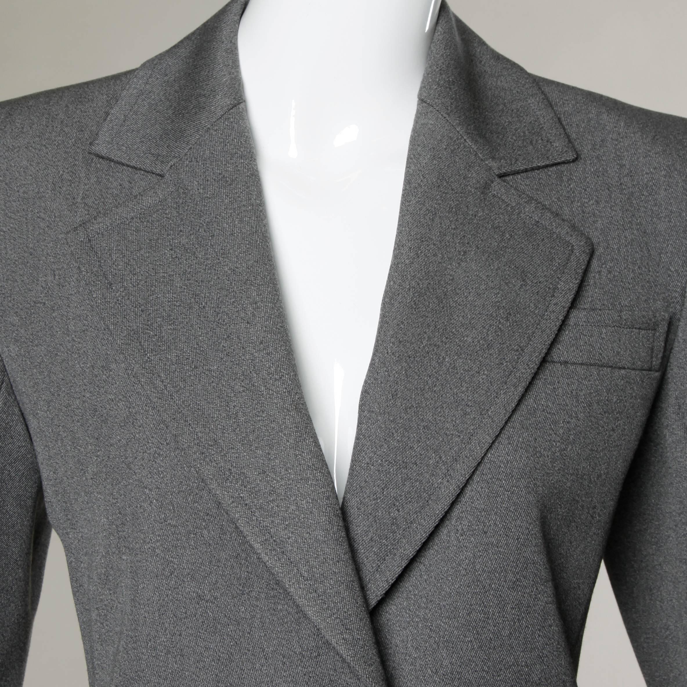 Beautifully tailored gray wool blazer jacket by Saint Laurent . 
Details:

Fully Lined
Front Pockets
Shoulder Pads Are Sewn Into Lining
Front Button Closure
Marked Size: 38
Estimated Size: M
Color: Gray
Fabric: Wool
Label: Saint Laurent/ Rive