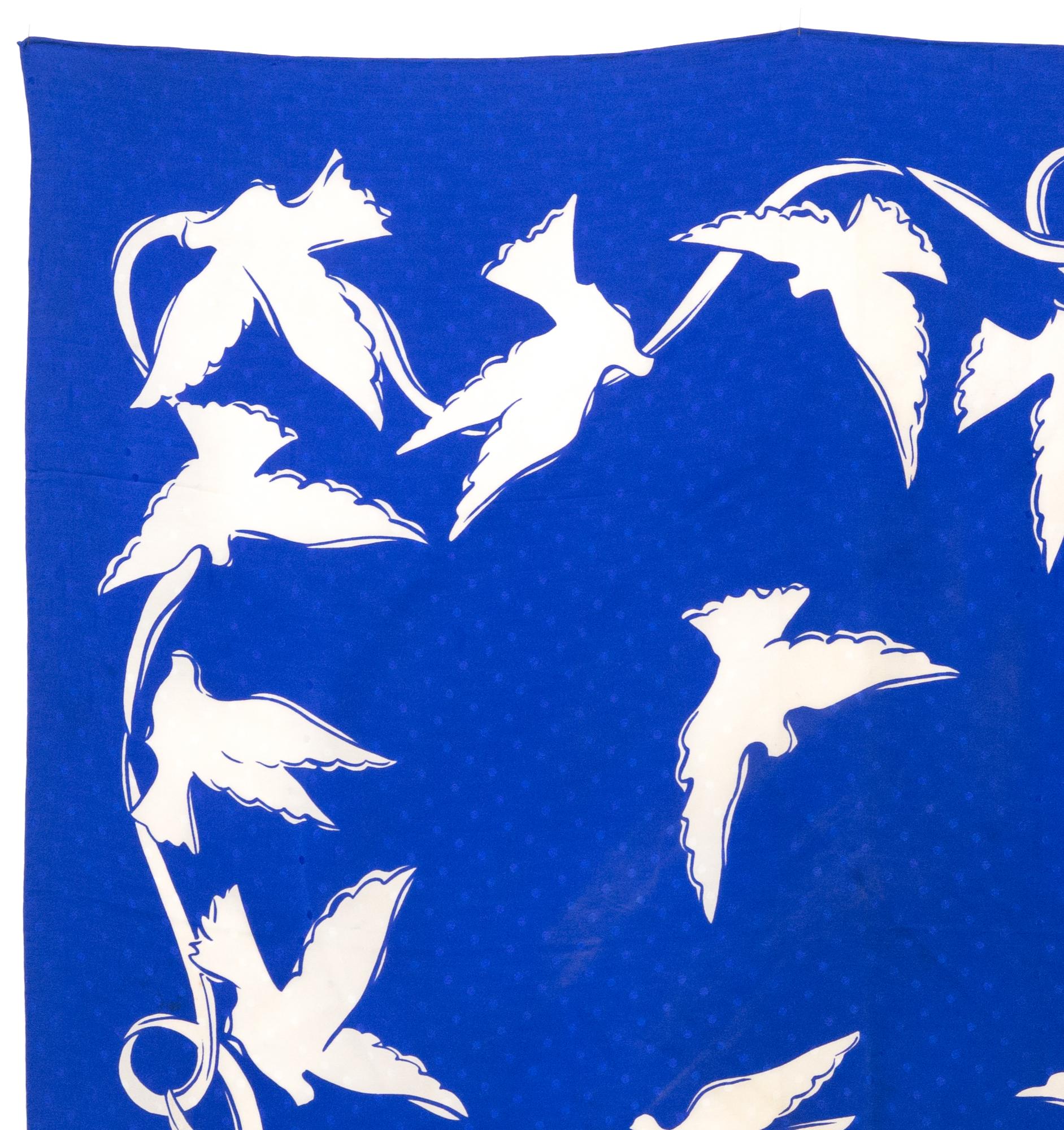 YSL Yves Saint Laurent  silk scarf featuring white doves, a blue jacquard ground, a YSL signature. 
Circa 1980s
In good vintage condition. Made in France.
34.6in. (88 cm) X 34.6in. (88 cm)
We guarantee you will receive this  iconic item as described