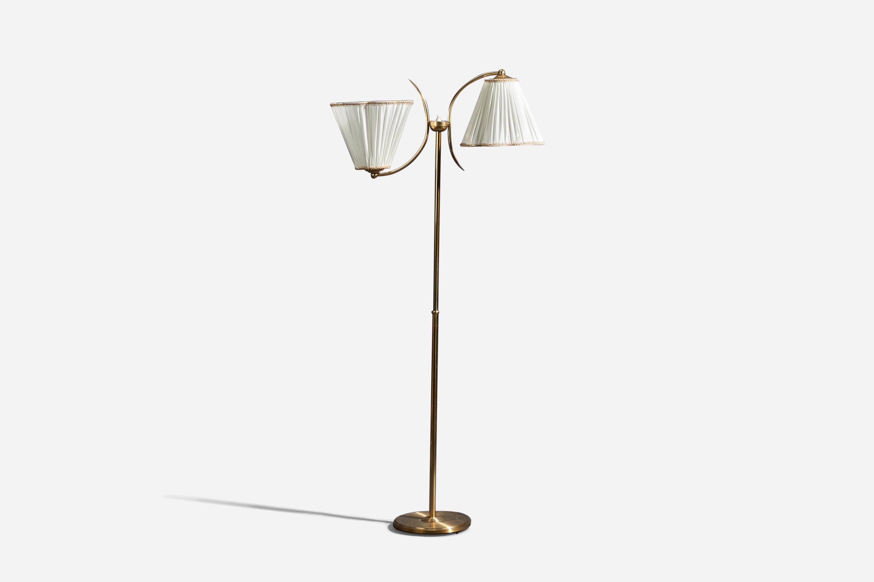 A brass and fabric floor lamp designed and produced by Ystad Metall, Sweden, 1940s.

Sold with Lampshades. Dimensions stated are of Floor Lamp with Lampshades. 

Sockets take standard E-26 medium base bulbs.

There is no maximum wattage stated