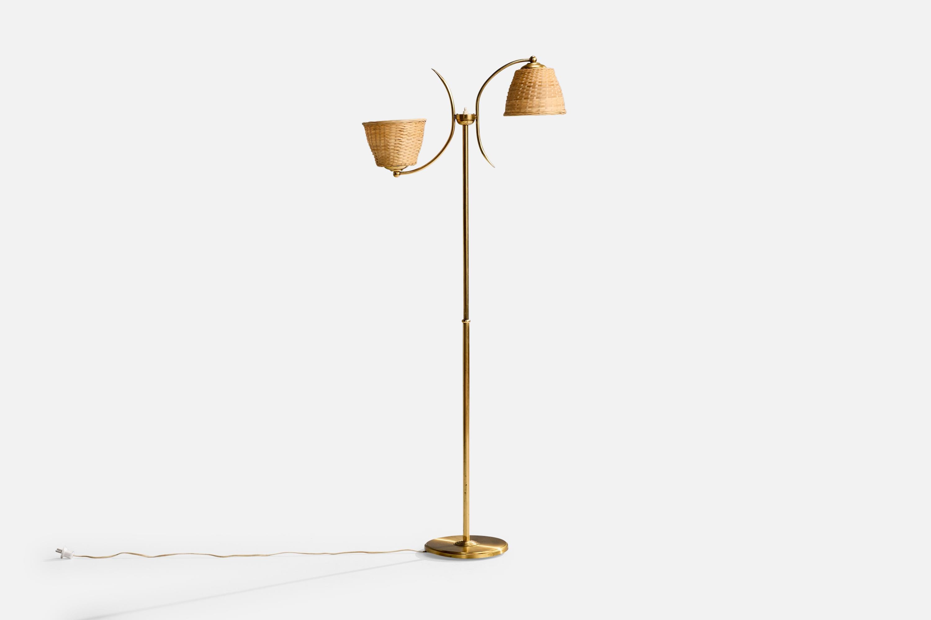 A brass and fabric floor lamp produced by Ystad Metall, Sweden, c. 1950s.

Overall Dimensions (inches): 55
