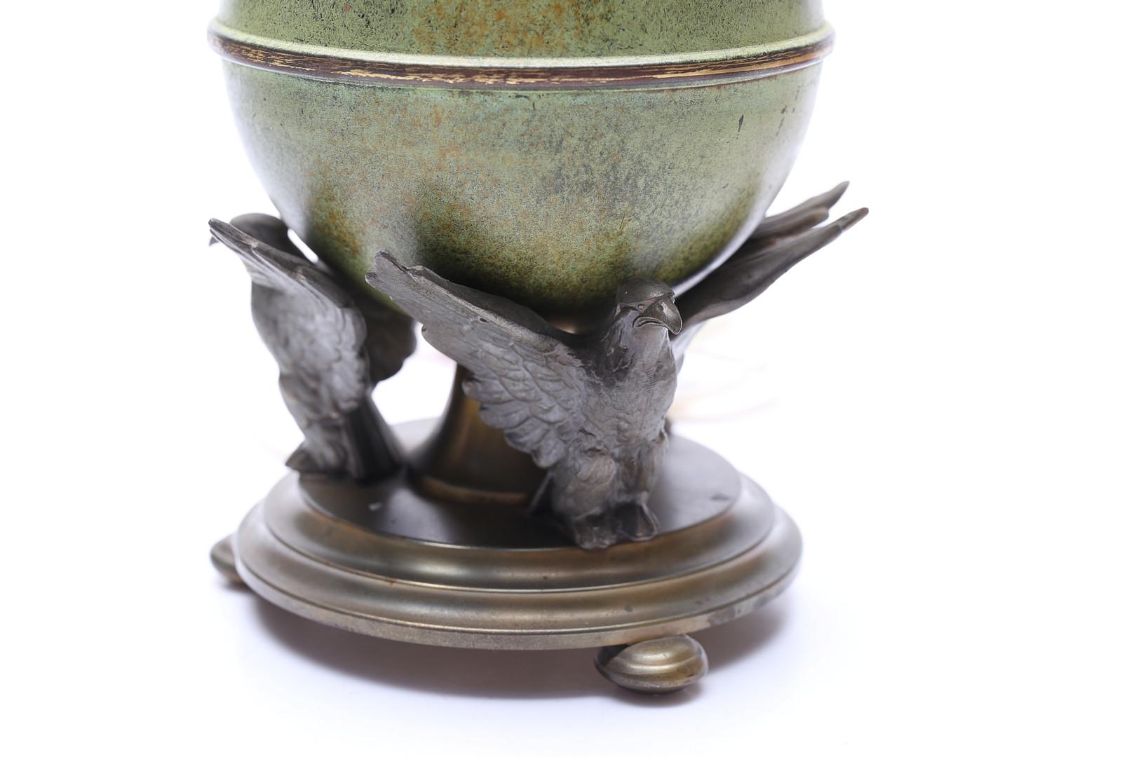 This exquisite table lamp, designed and crafted by Ystad Metall in Sweden, is a stunning example of mid-century Scandinavian artistry and exceptional metalwork. The lamp features a beautifully sculpted patinated bronze base, paired with intricately