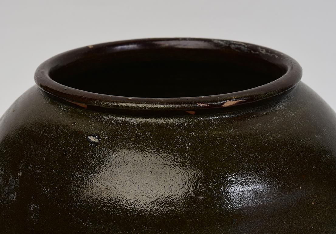 Chinese brown glazed pottery jar with round shape.

Age: China, Yuan Dynasty, 13th Century
Size: height 21.8 cm / width 27.5 cm
Condition: Well-preserved old burial condition overall.

100% Satisfaction and authenticity guaranteed with free