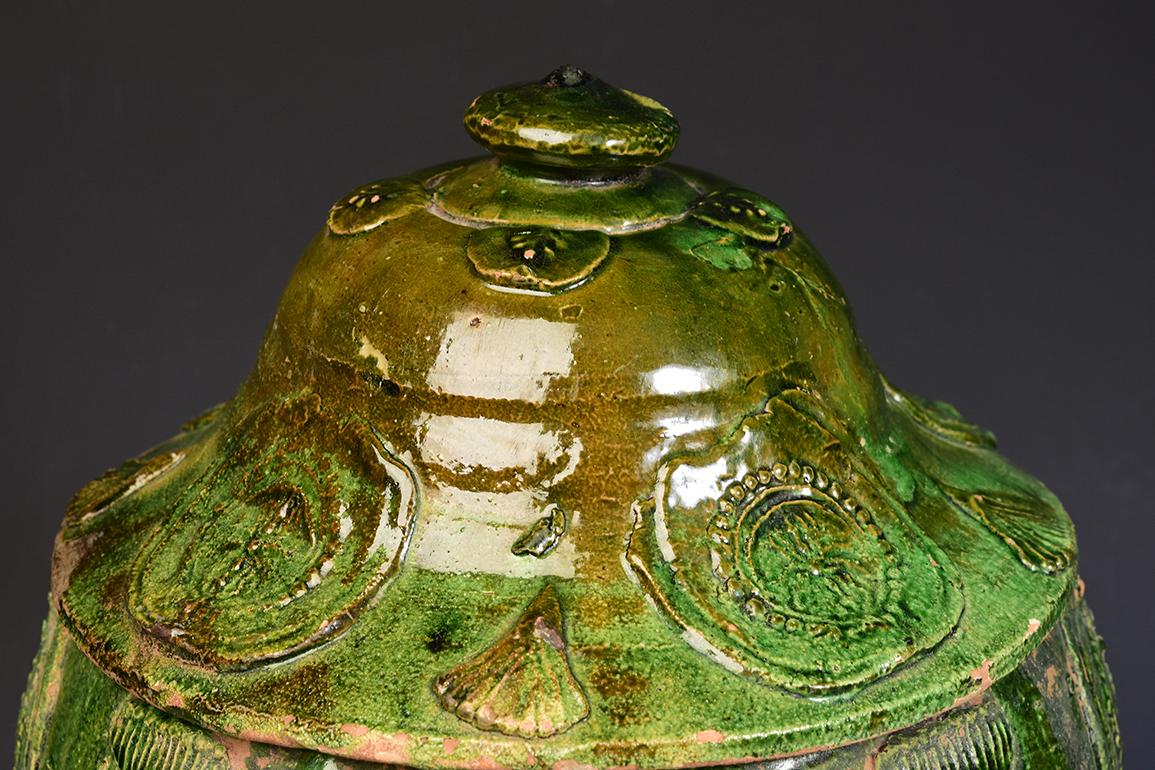 Chinese green glazed pottery covered jar.

Age: China, Yuan Dynasty, A.D. 1271 - 1368
Size: height 35 cm / width 25 cm.
Condition: Well-preserved old burial condition overall.

100% Satisfaction and authenticity guaranteed with free
