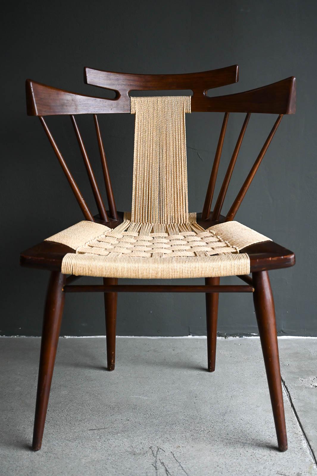 Yucatan Chair in Mahogany by Edmond Spence, ca. 1950.  Rare 'Yucatan' woven seat captains chair in mahogany by Edmond J. Spence.  Chair has had new woven seat, frame is original.  Frame does have some wear on the legs and seat and at some point in