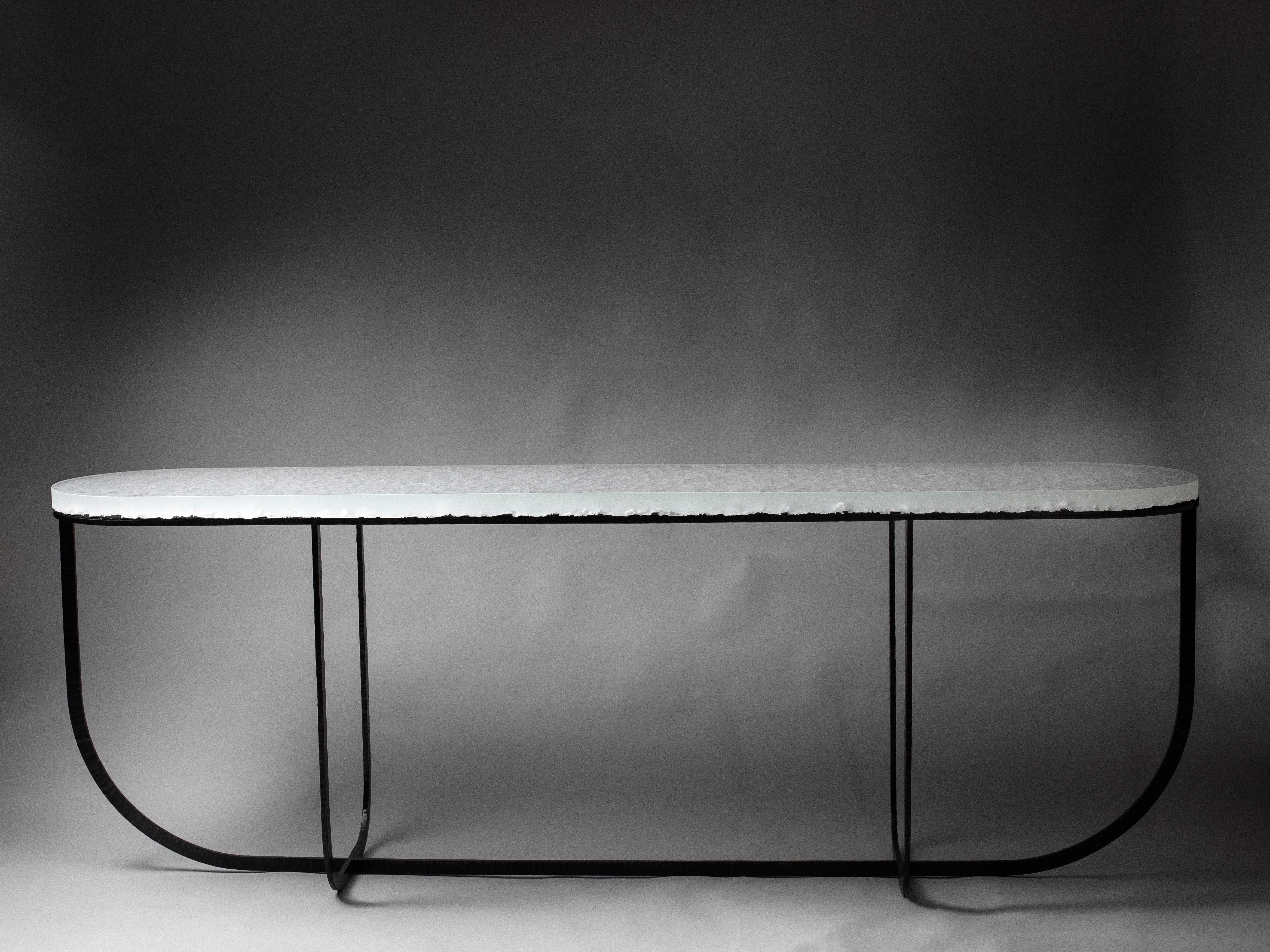 Yugen Console by Matthieu Gicquel
Dimensions: D 50 x W 230 x H 80 cm.
Materials: Optical glass and patinated metal.
Weight: 140 kg.

Each piece is numbered. Please contact us.

Praise for the moment
Light shines through the glass. Details are
