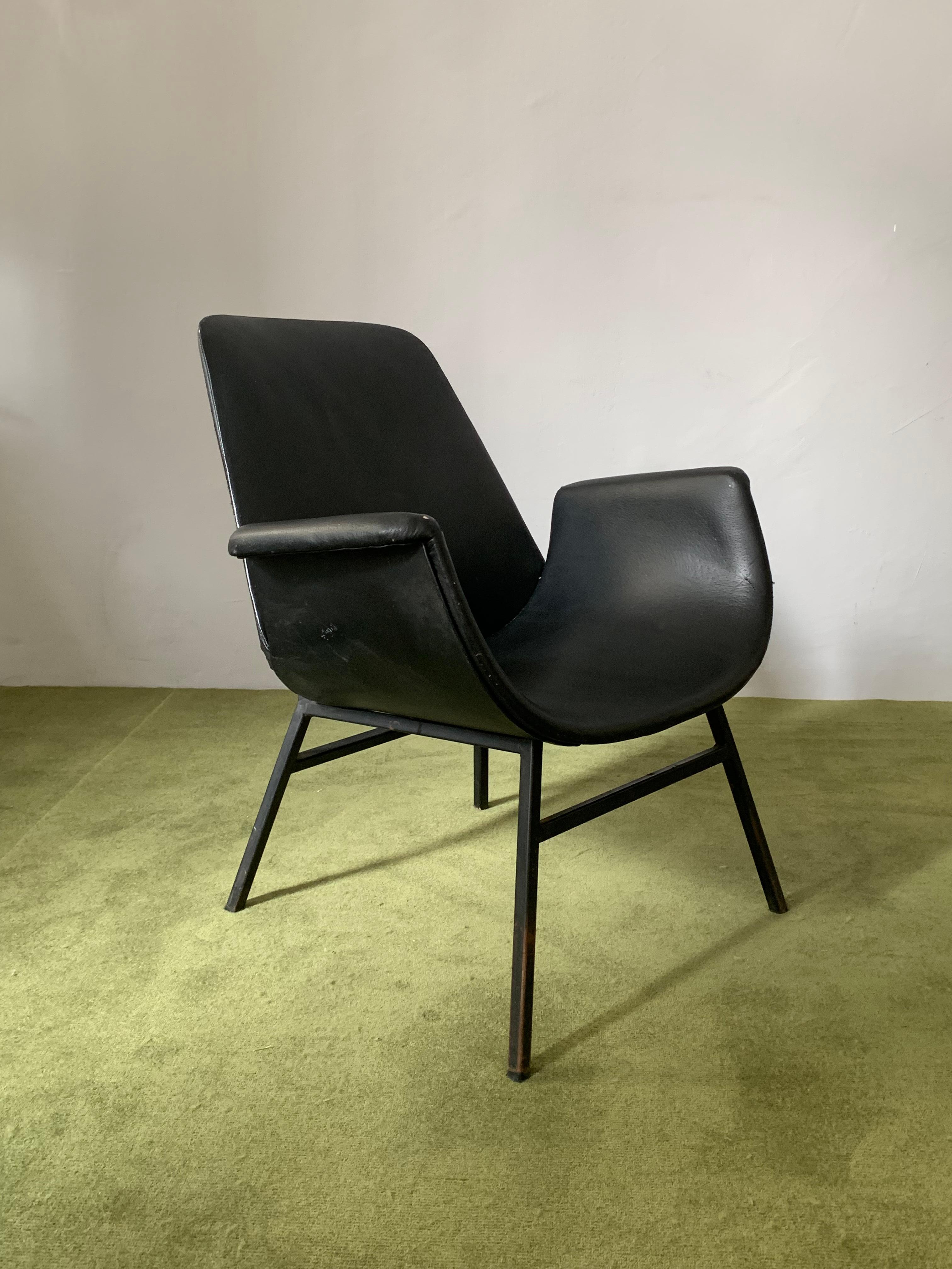 This lovely vintage armchair was produced in 1960s-1970s Yugoslavia, made after the design of Alvin Lustig, design pioneer for Paramount Furniture in the 1950s. 
The chair is visually striking and structurally very solid, with an angular metal frame