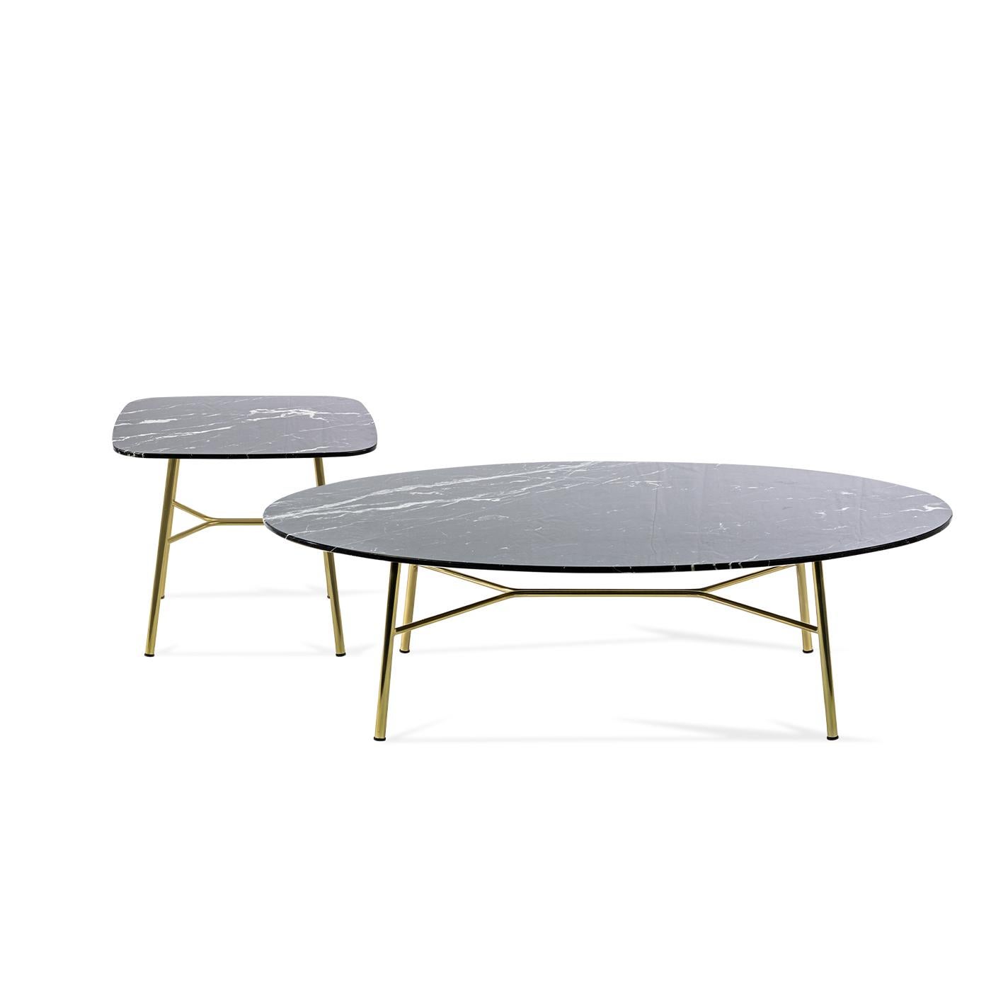 Boasting a fine Black Marquinia marble top set on a cylindrical metal base with a polished brass finish, this coffee table from the Yuki Collection brings timeless elegance and functionality to a modern living room or office lounge. Uniquely