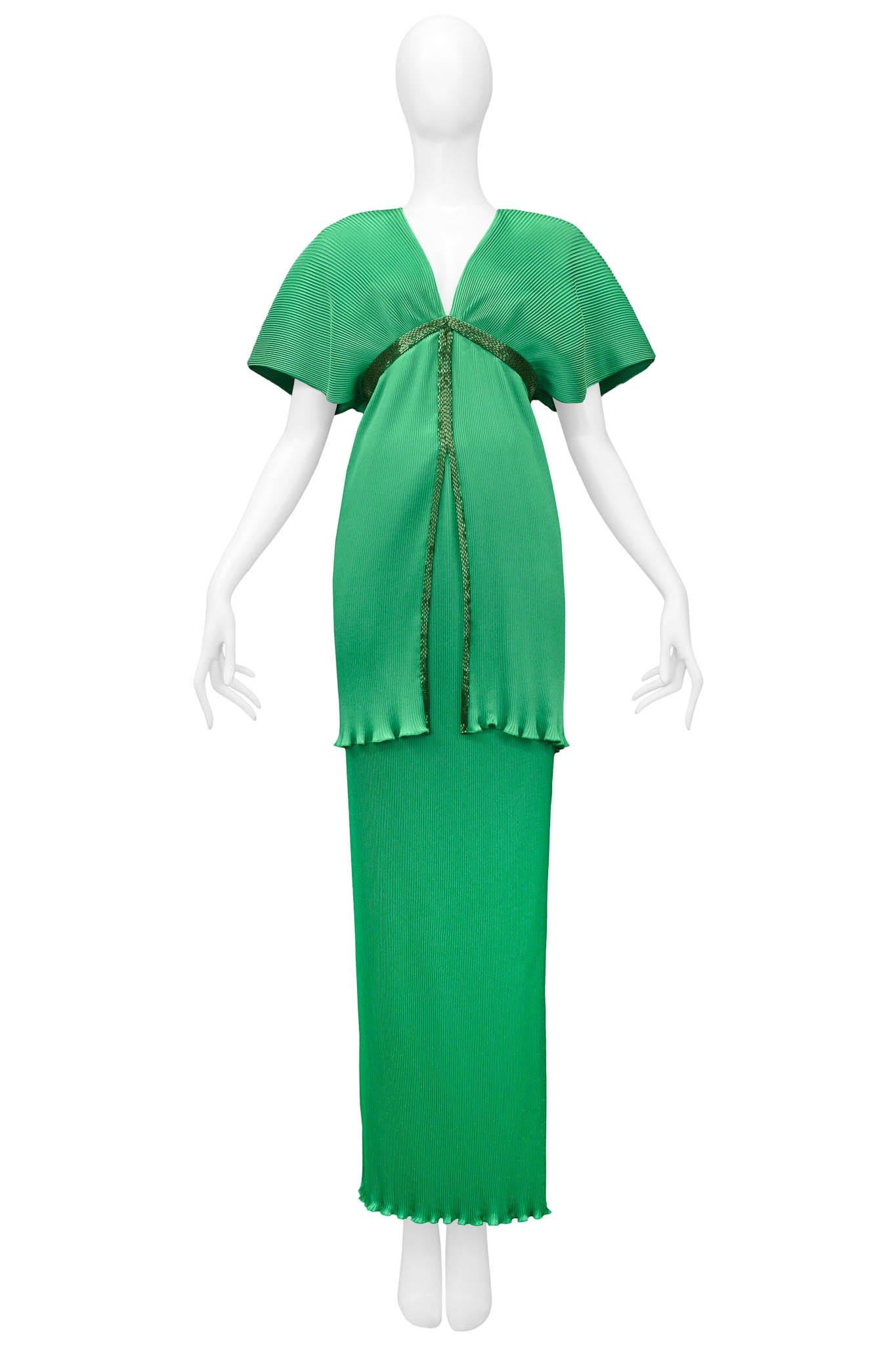 Resurrection Vintage is excited to offer a stunning vintage emerald green Yuki pleated top and skirt ensemble featuring, green bugle bead trim, lettuce hem, shoulder pads, a zipper down the back for the top, and an elastic waistband for the