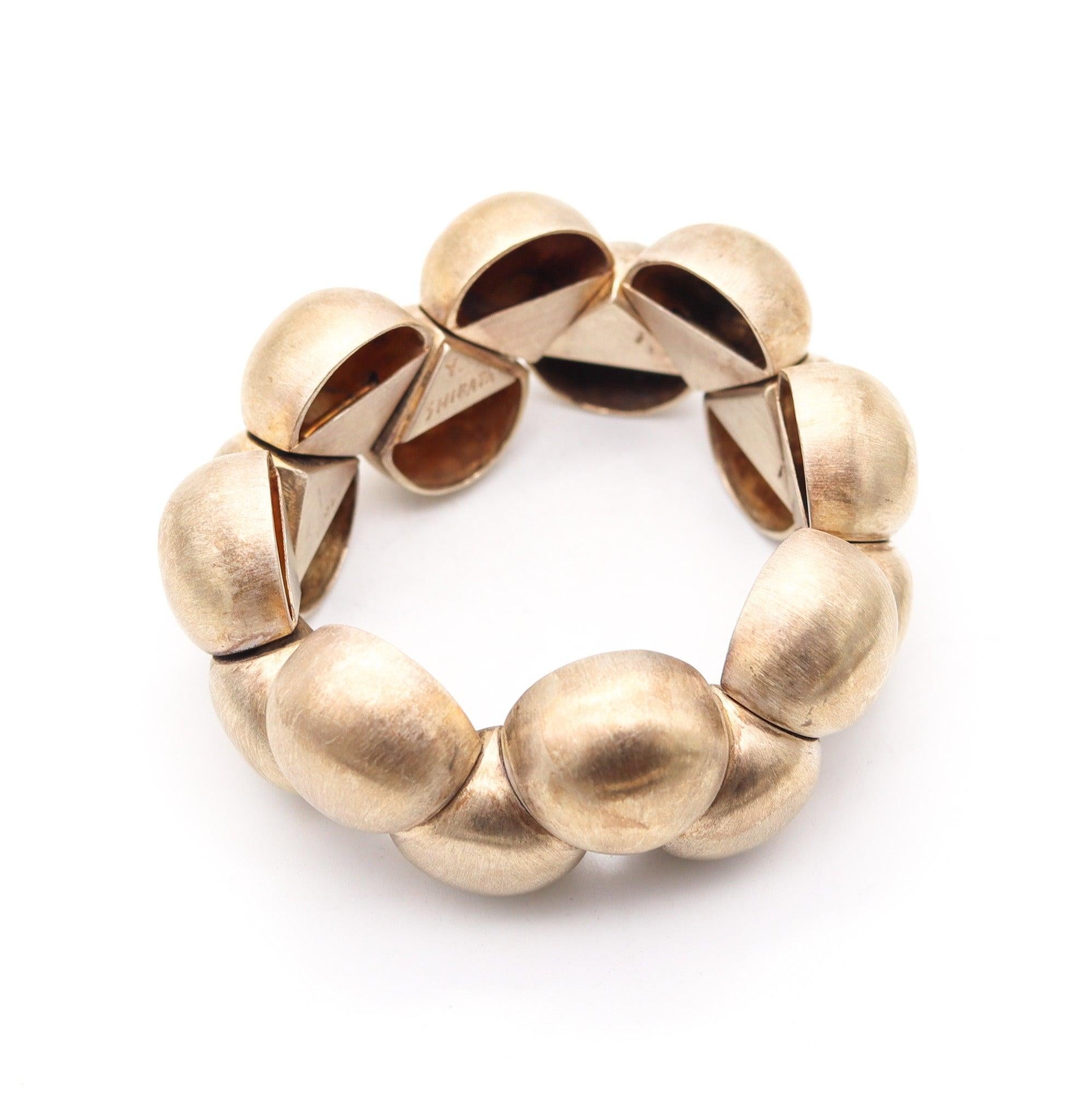 A flexible bracelet designed by Yukihiro Shibata.

This is a wonderful bangle bracelet created by Yukihiro Shibata, back in the 1980's. Masterfully crafted in solid .950/.999 sterling silver with a delicate brushed finish and accented with gold