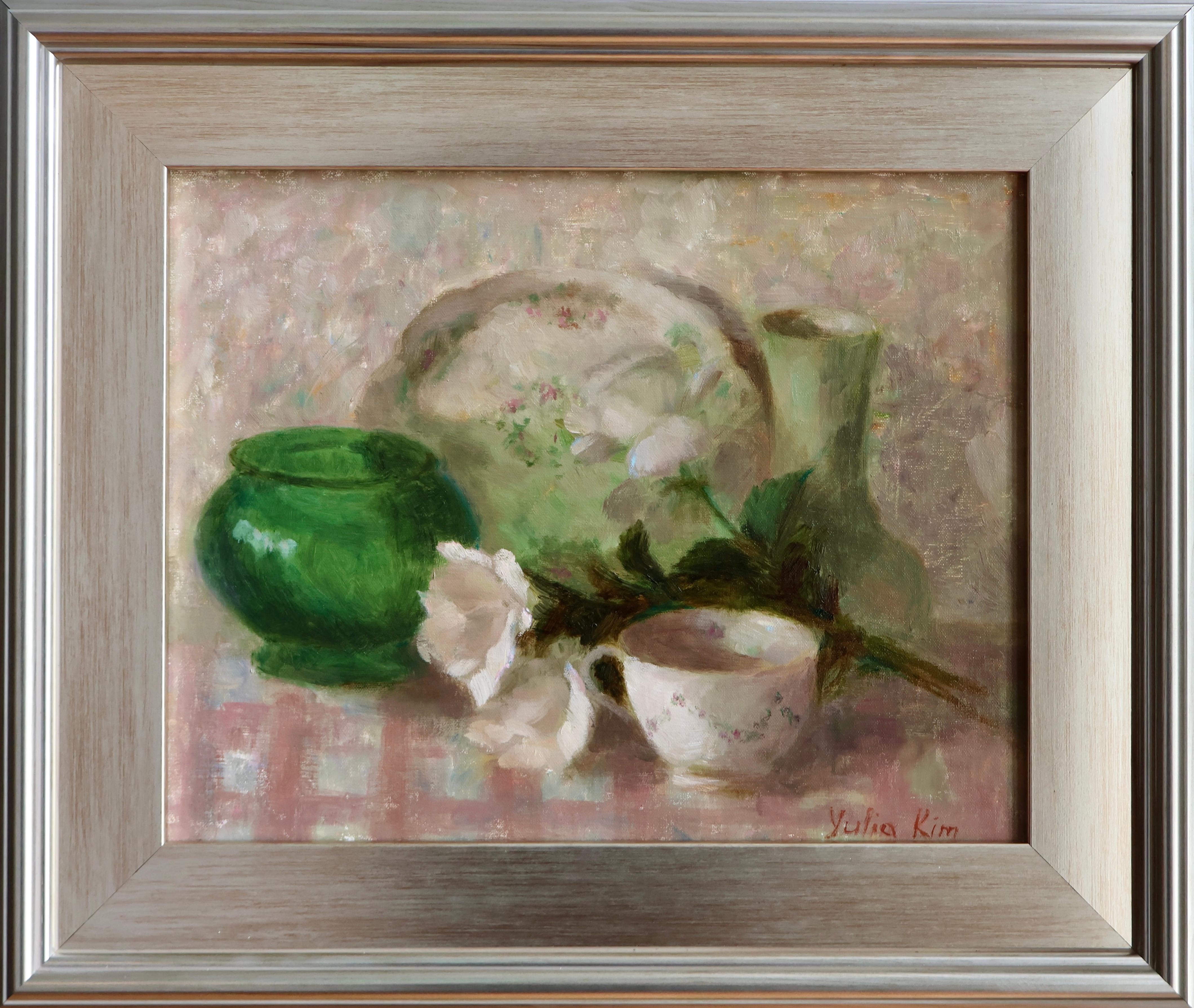 This 11" x 14" oil painting on panel by Oklahoma-based, Kazakhstan-born artist Yulia Kim features a light and airy palette of pale pinks, soft whites, and greens that pop from the panel. The beige background of the still life is created using