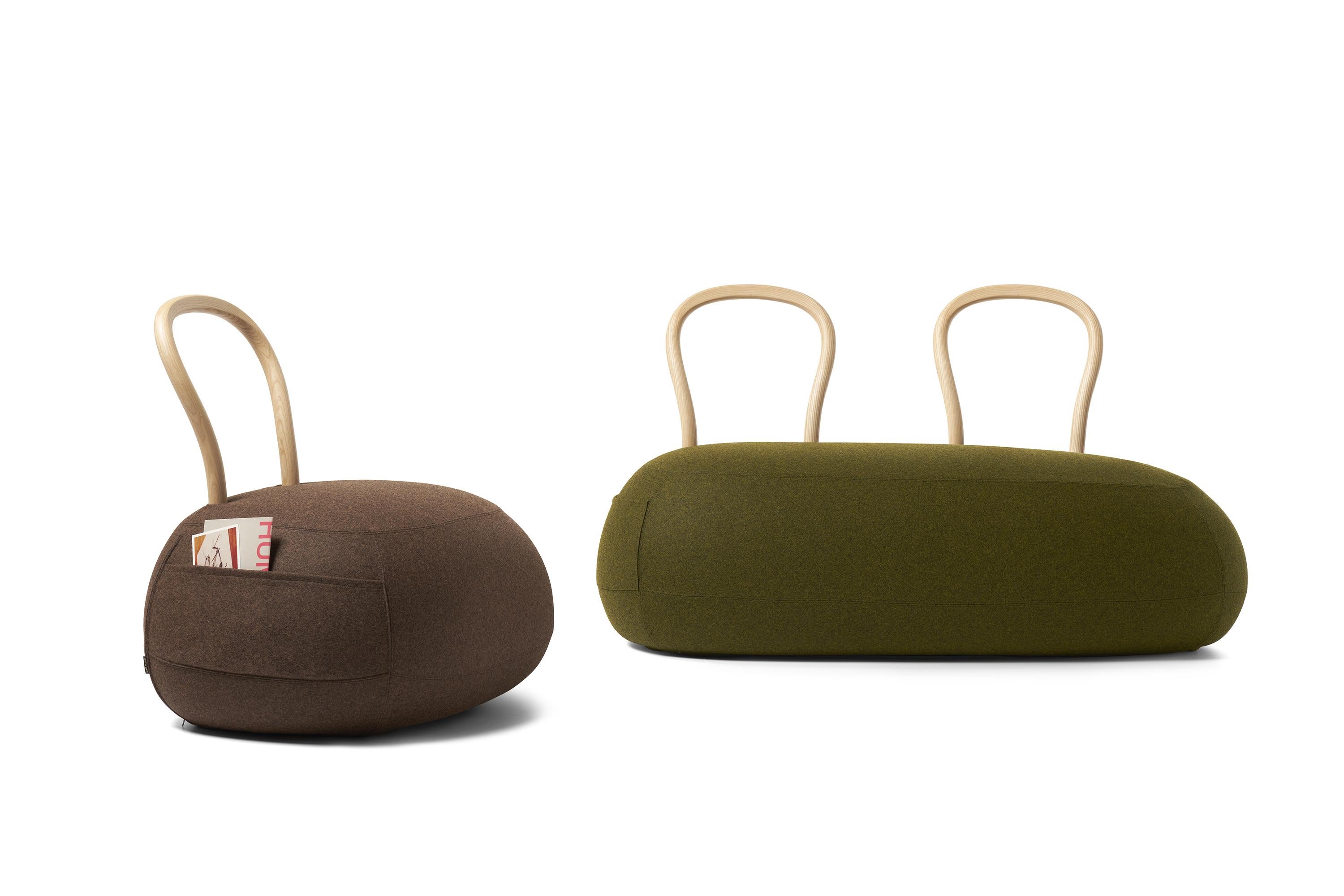 The Yum Yum seating collection has an answer for all this and even more. It is a sum of opposites, and as such, utterly charming.

Yum Yum is a pouf with a backrest, precisely a soft padded pouf with a strong wooden backrest. But it is also a