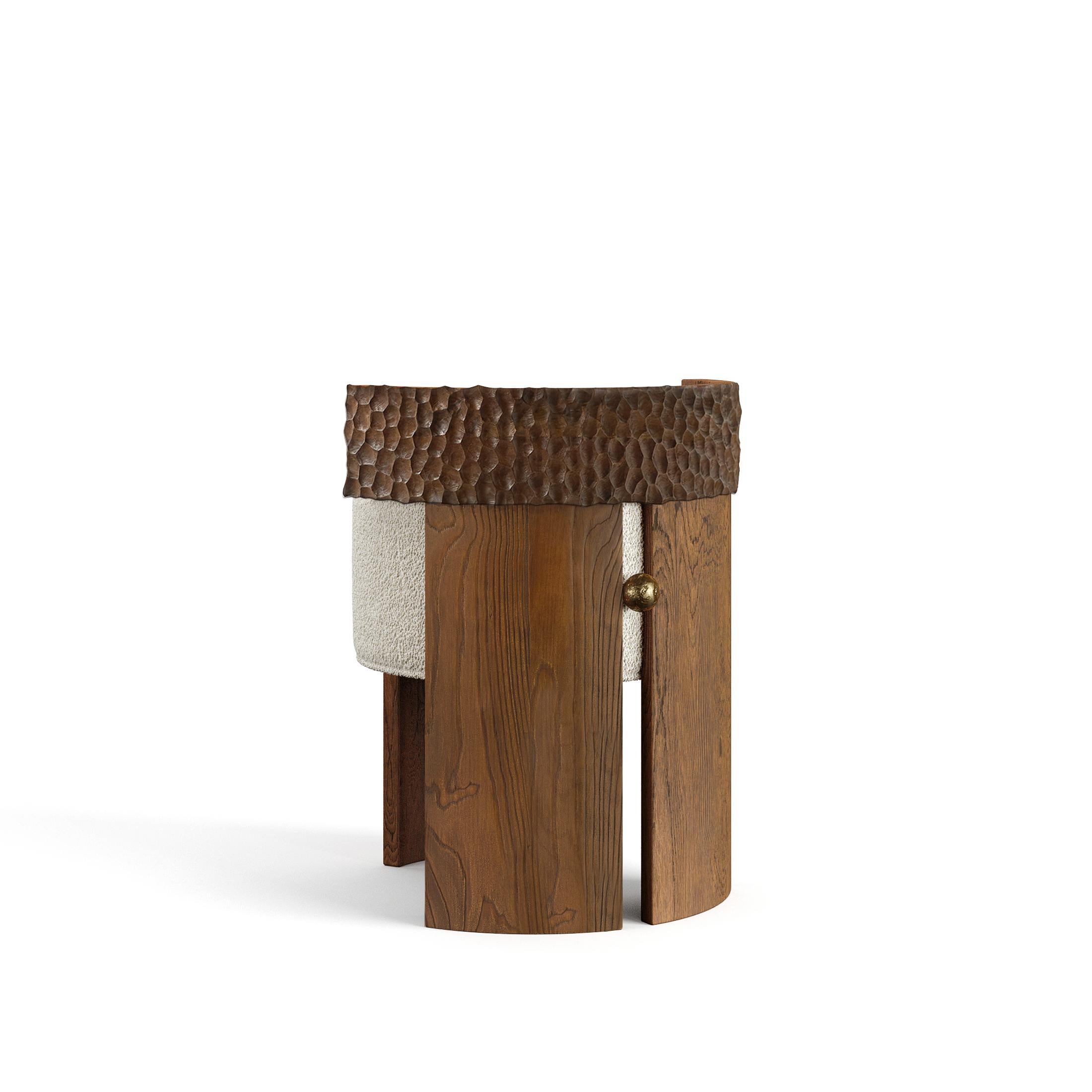 The Yumi Stool is a handcrafted piece of furniture that combines solid wood and liquid bronze for a unique appearance. The stool is made using traditional techniques such as hand carving and casting, ensuring that each piece is one-of-a-kind that