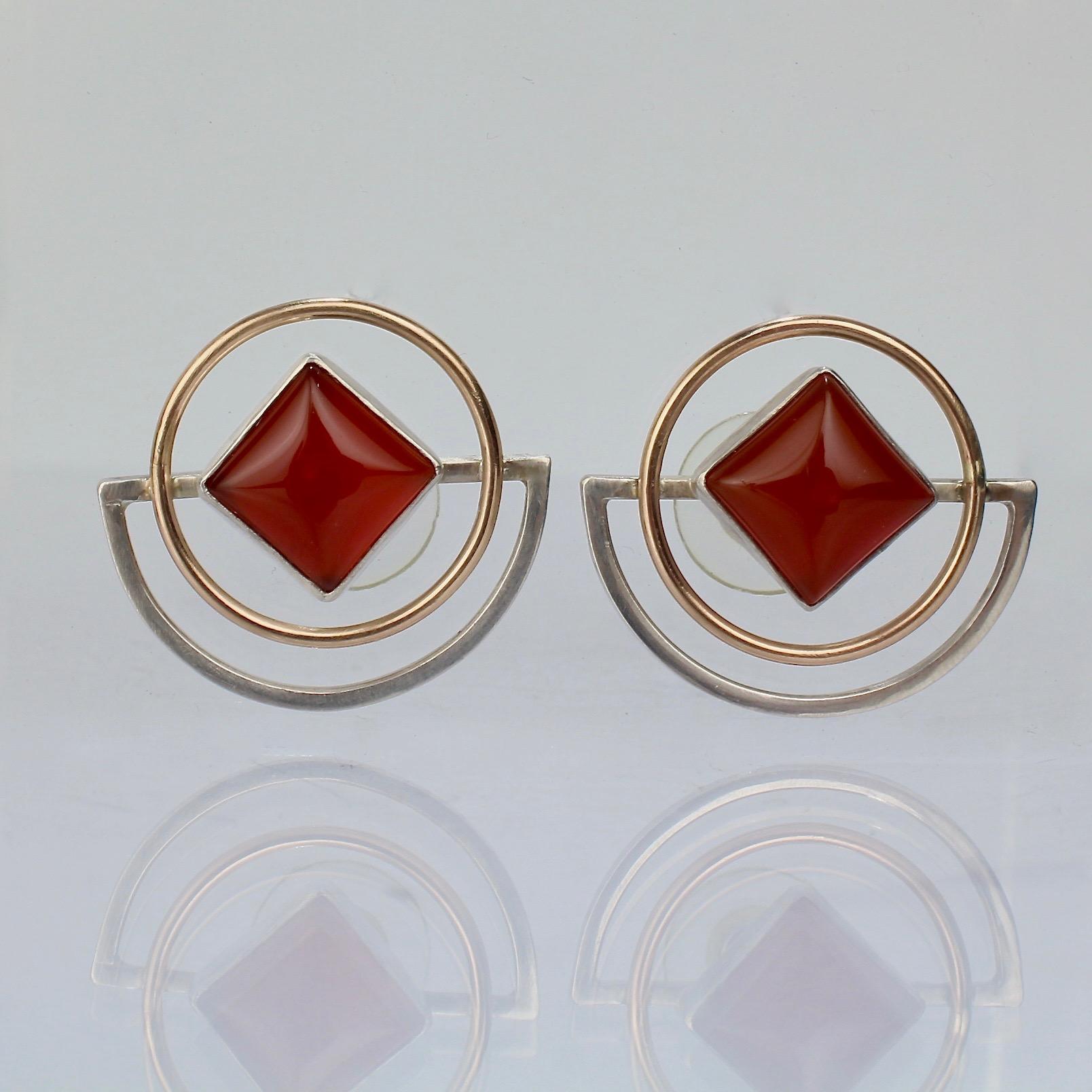 A fine pair of Yumi Ueno retro geometric gold, silver, & carnelian earrings.

Date:
20th Century

Overall Condition:
They are is in overall good, as-pictured, used estate condition with some very fine & light surface scratches and other signs of