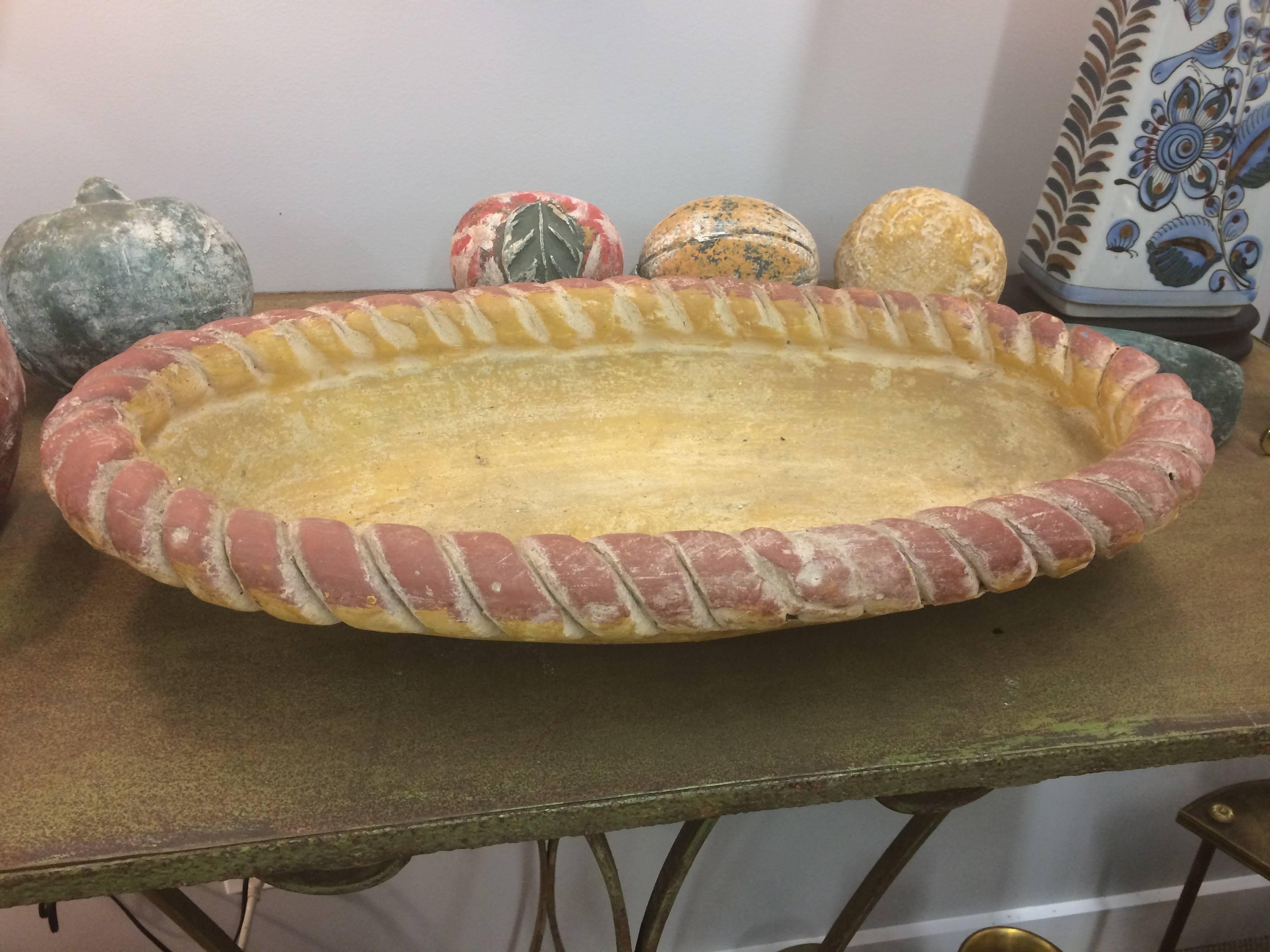 Wonderful table top accessory of hand-painted clay having a large braided fruit bowl filled with stylized watermelon wedge, bananas, oranges, etc.