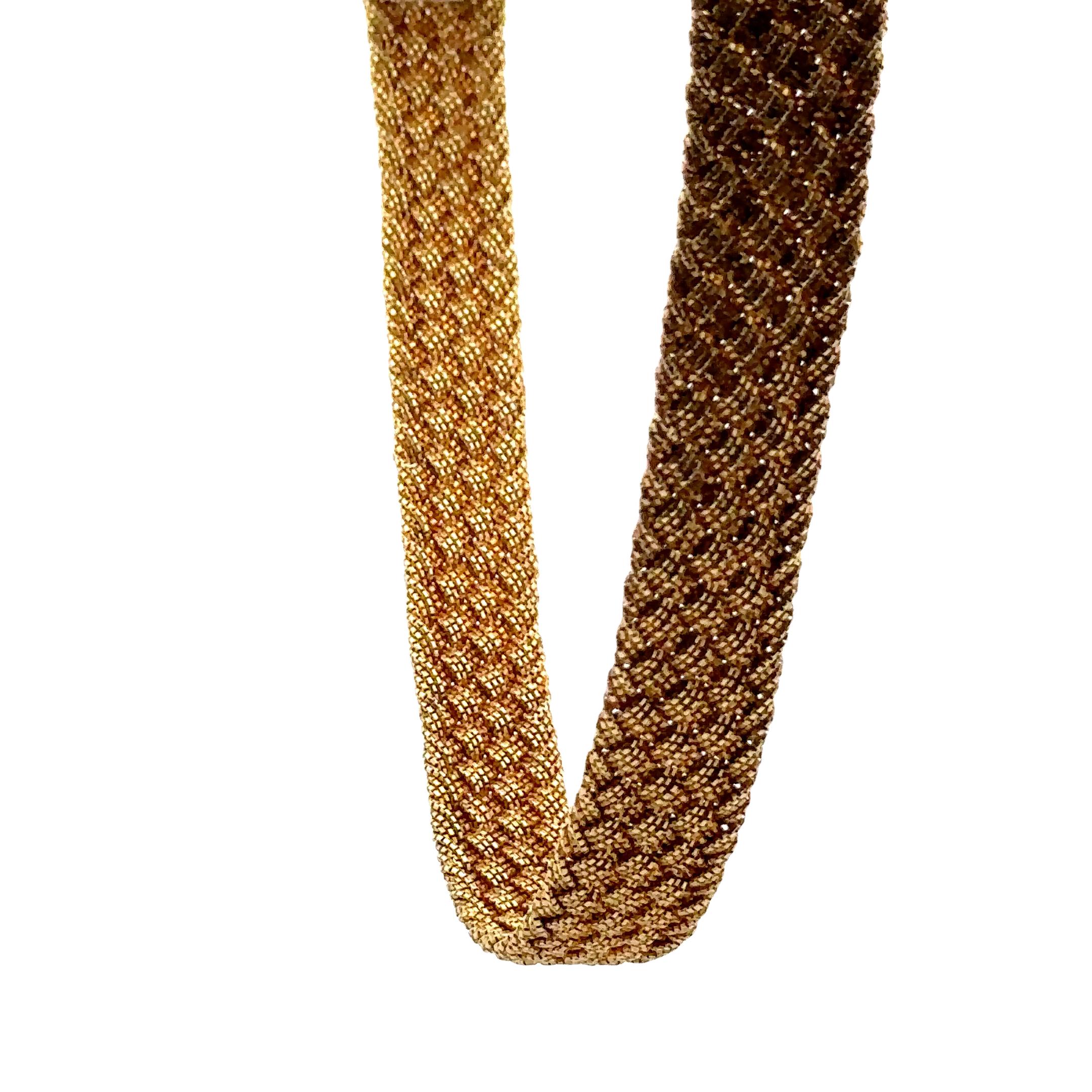 This Yuri Ichihashi Micro Braided Choker Necklace is an intricately made piece made from thin strands of 18-karat yellow gold braided over and over into this head turner of a piece. 

This choker feels like a thin weighted blanket of textured gold