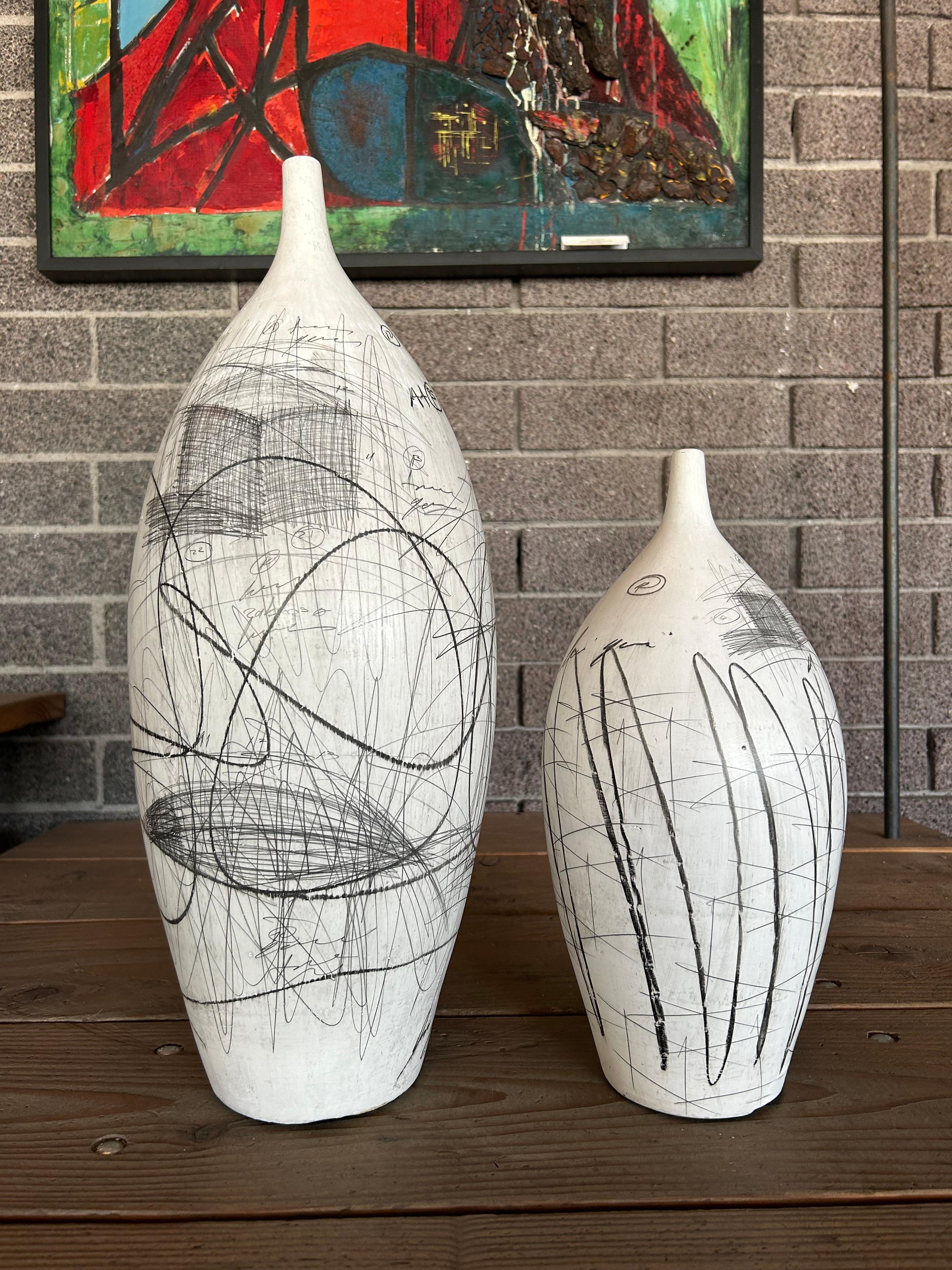 Pair of large scale Yuri Zatarain porcelain vases circa late 1980’s. These examples have the artists signature scraffito pencil work incorporated into the glaze. Price listed is for both works. 