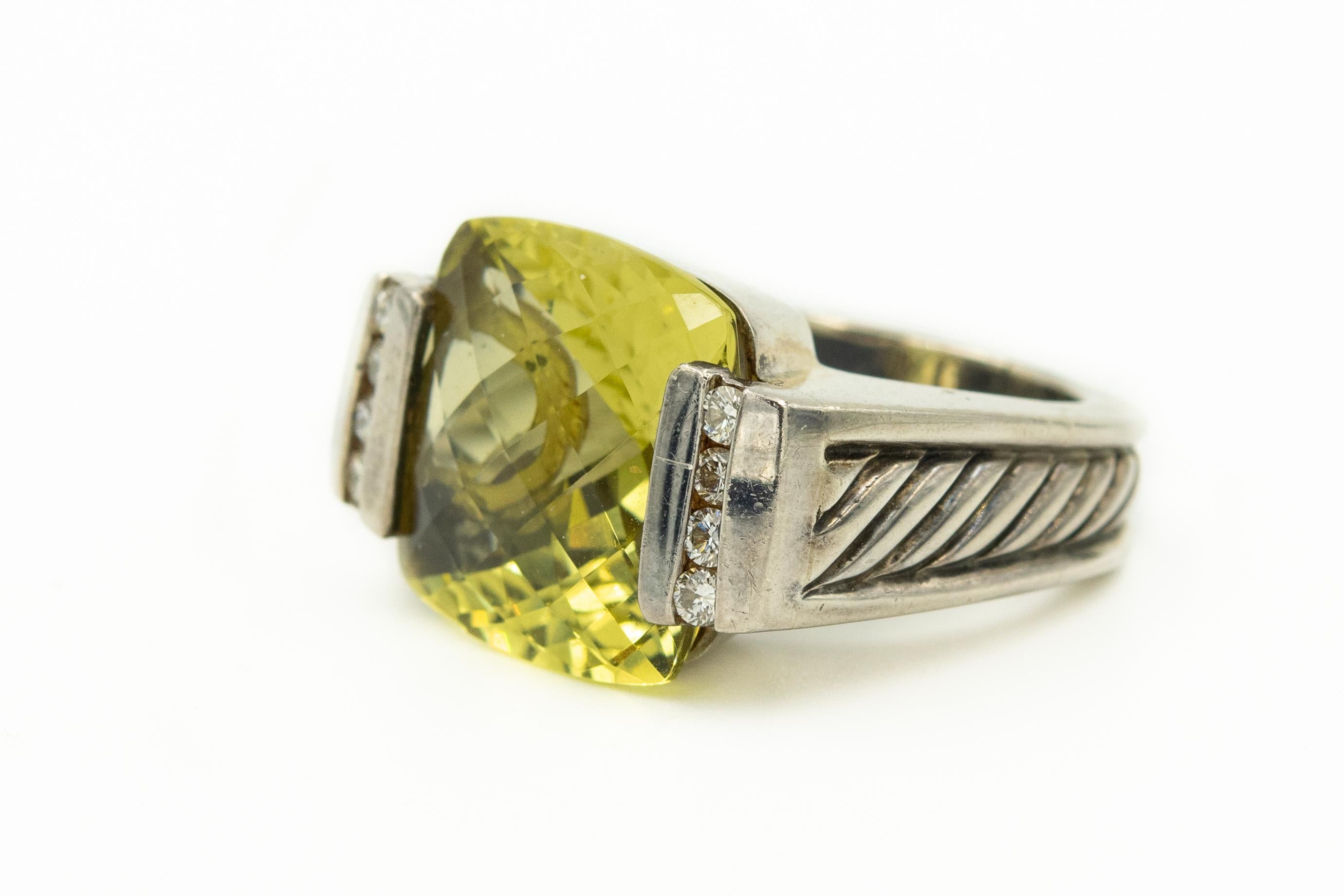 David Yurman sterling silver cocktail ring from the Deco collection. Features a cushion-shaped lemon quartz center with channel-set round brilliant diamonds at sides and cable motif throughout shank. Size: 5.5; can be resized. Hallmarked: 585, 925