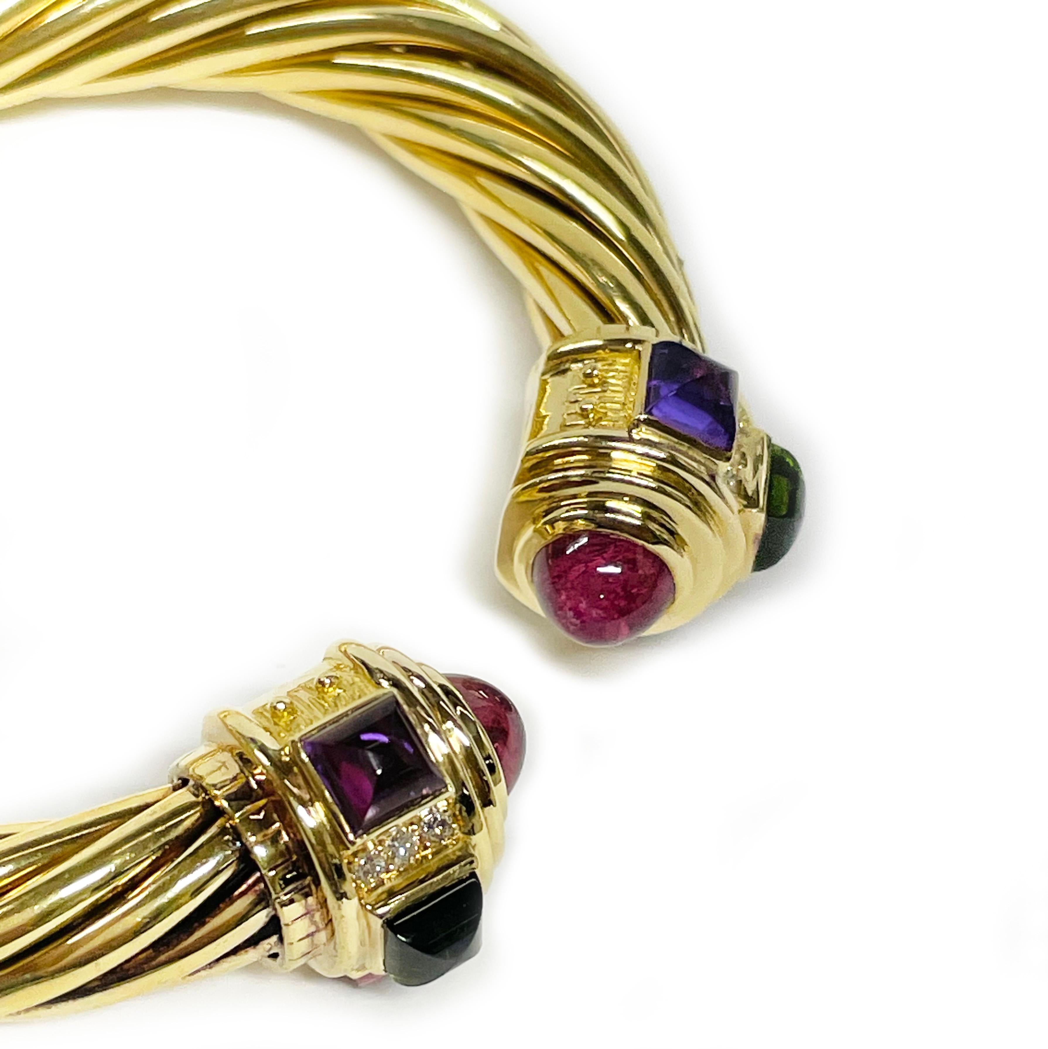 Manchette en or jaune avec câble multi-pierres.

Le design classique du câble introduit du mouvement, de la texture et de la profondeur dans la pièce. Il s'agit d'un bracelet manchette classique en or 18 carats de Yurman, orné d'une citrine. Il met