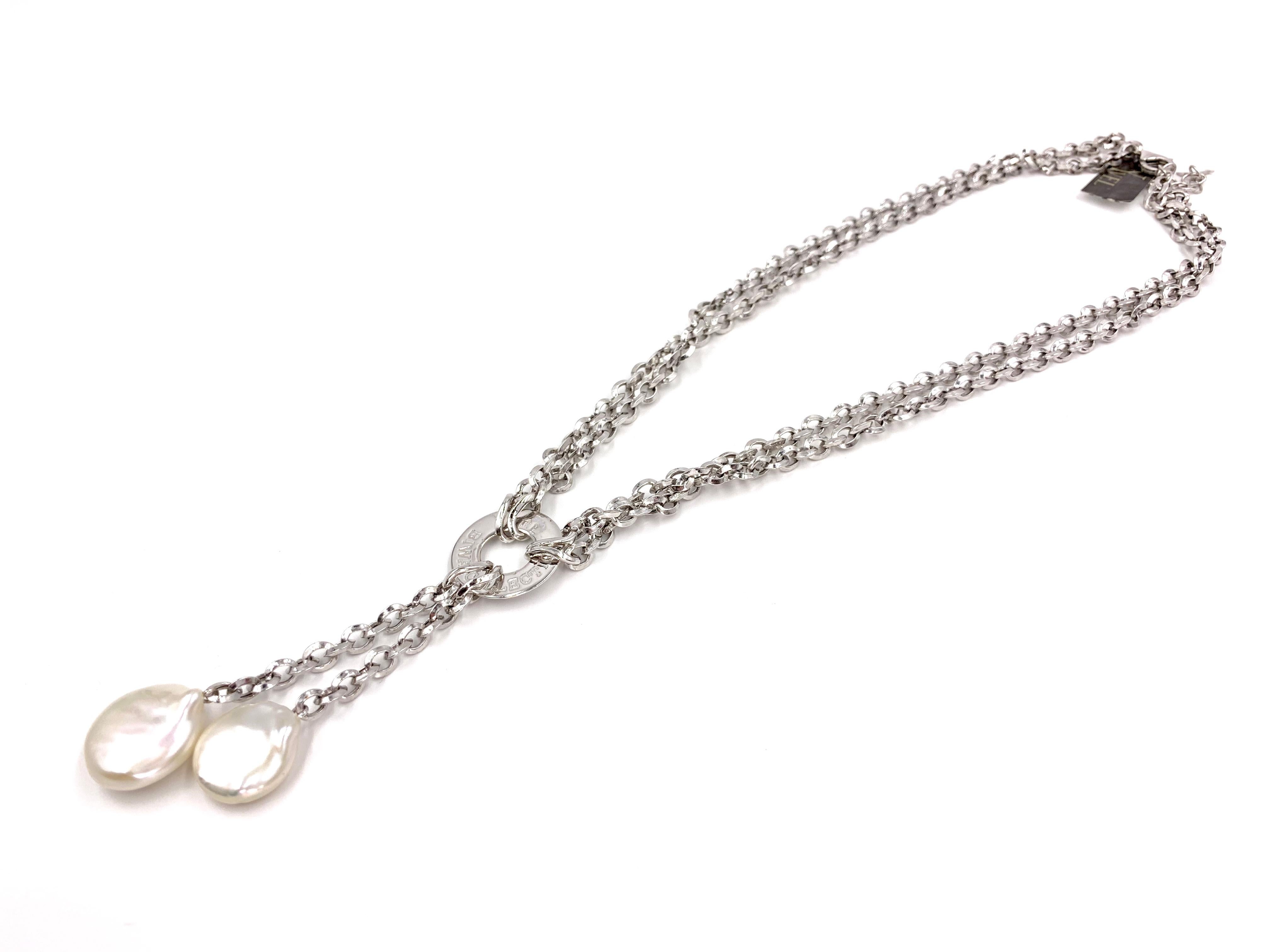 A wearable and fashionable 18 karat white gold double link chain lariat style necklace with two baroque pearls that drop from the center, expertly crafted by leading designers in fine pearl jewelry, Yvel company. Two flat 15mm baroque pearls drop