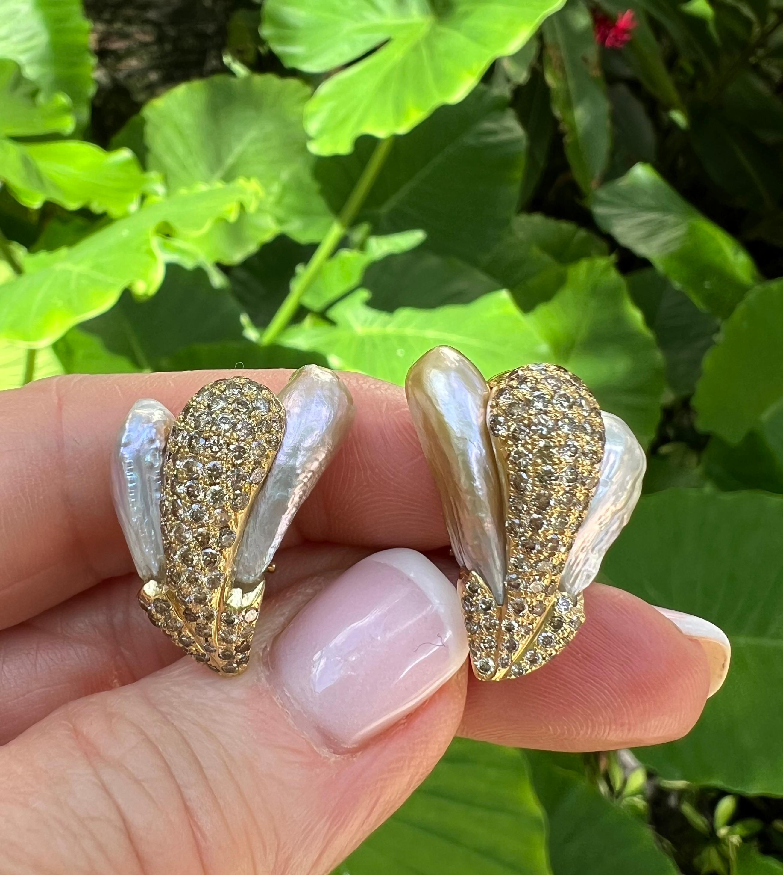 Yvel clip earrings, featuring natural baroque freshwater pearls accented by champagne-colored brilliant-cut diamonds pave-set in 18 karat yellow gold.  Four natural freshwater baroque pearls in rose/ blue/ gray iridescent colors.  Pearls 16.5-21mm