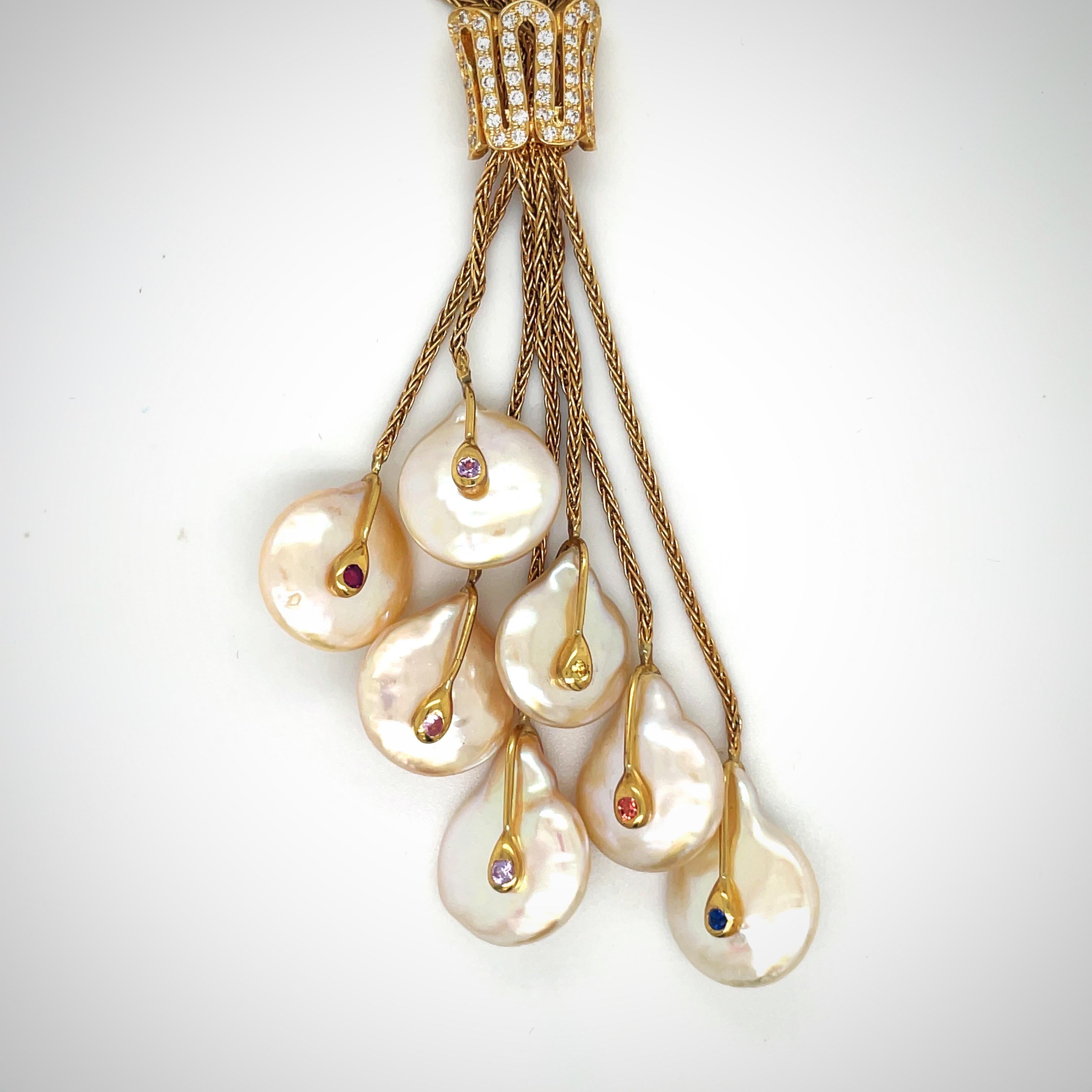 Rare organic pearls are Yvel's signature design. Cellini Jewelers NYC presents their 18 karat yellow gold necklace with 7 flat freshwater pearls. The 21